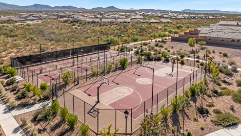 Welcome to The Oasis at Rocking K, a premier D.R. Horton new home community nestled in the picturesque landscapes of Vail, Arizona, where new homes blend seamlessly with the breathtaking surroundings of the Rincon Mountains. Experience the perfect balance of tranquility and modern convenience in this master-planned neighborhood, designed to offer a lifestyle that caters to families, nature enthusiasts, and anyone seeking a peaceful yet connected community. The Oasis at Rocking K features five beautifully designed one-story floor plans ranging from 1,400 to 1,900 square feet, each crafted with the high-quality features and finishes D.R. Horton is known for. Homes in Rocking K feature a Spanish lace stucco exterior, tile roofs, and meticulously landscaped front yards with auto drip irrigation. Inside, you’ll find luxurious quartz countertops in the kitchens and bathrooms, 42” shaker-style cabinets with modern cabinet pulls, and wood-look tile flooring throughout the main living areas. Homes also include covered front porches and back patios, perfect for enjoying Arizona’s stunning sunsets and clear night skies. Each home in The Oasis at Rocking K is equipped with D.R. Horton’s Home is Connected® Smart Home package, which includes a smart thermostat, video doorbell, keyless entry, Wi-Fi-enabled garage door opener, and Deako light switches. Additionally, these homes meet the stringent DOE Zero Energy Ready Home standards, making them not only comfortable and modern but also exceptionally energy-efficient. With features like spray foam insulation, tankless water heaters and LED lighting, these homes are designed to reduce your environmental footprint and provide long-term savings on energy costs. Living at Rocking K means being part of a vibrant, family-oriented community with a strong sense of connection among residents. The Oasis at Rocking K offers a variety of amenities, including ramadas, picnic tables, and grassy areas perfect for gatherings. Residents also have access to the greater Rocking K master-planned neighborhood amenities, such as a splashpad, large event lawn, walking paths, multipurpose fields, basketball and pickleball courts, and an innovative playground with a zip-line and jungle gym. The new K-8 school, set to open in 2025, is just one of the many features that make Rocking K ideal for families. Life at Rocking K is further enriched by a lively calendar of lifestyle events, thoughtfully organized by the Rocking K Homeowners Association. These events are a cornerstone of community life, fostering a strong sense of connection among residents. Whether you’re looking to enjoy a quiet evening star gazing in the park or engage in fun activities with neighbors, there’s always something happening. The quarterly lifestyle calendar is packed with regular and seasonal events, including movie nights in the park, sports and summer camps for kids, and wine tasting events for adults. Families can join hiking groups, participate in trivia nights, or enjoy the various holiday celebrations. The community comes alive during the holidays with loads of themed events, arts and crafts fairs, and car shows. Rocking K’s commitment to providing a dynamic and engaging environment ensures that there’s always an opportunity to make memories and build lasting friendships right in your neighborhood. Residents of Rocking K benefit from easy access to I-10, making commutes to Tucson and surrounding areas a breeze. The community is close to major employers such as Davis-Monthan Air Force Base, Raytheon, and the University of Arizona, as well as top-notch healthcare facilities like TMC Rincon and Northwest Hospital East. The nearby Houghton Town Center and Houghton Rd. business corridor offer convenient shopping, dining, and services. For outdoor enthusiasts, Rocking K is surrounded by natural beauty and recreational opportunities. Explore the hiking and biking trails at Colossal Cave Mountain Park, Saguaro National Park East, and the Arizona Trail. Enjoy golfing at Del Lago Golf Course, or take a short drive to Sonoita for a day trip to Arizona’s Wine Country. Whether it’s hiking, camping, or simply taking in the stunning views, Rocking K is your gateway to the great outdoors. With 360-degree mountain views, calm and quiet evenings, and a location that’s close to everything you need, Rocking K is truly a community where you can thrive. Experience the best of Arizona living at The Oasis at Rocking K, where your new home awaits in a community that offers everything you need for a fulfilling lifestyle.