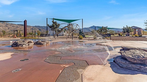 Welcome to The Oasis at Rocking K, a premier D.R. Horton new home community nestled in the picturesque landscapes of Vail, Arizona, where new homes blend seamlessly with the breathtaking surroundings of the Rincon Mountains. Experience the perfect balance of tranquility and modern convenience in this master-planned neighborhood, designed to offer a lifestyle that caters to families, nature enthusiasts, and anyone seeking a peaceful yet connected community. The Oasis at Rocking K features five beautifully designed one-story floor plans ranging from 1,400 to 1,900 square feet, each crafted with the high-quality features and finishes D.R. Horton is known for. Homes in Rocking K feature a Spanish lace stucco exterior, tile roofs, and meticulously landscaped front yards with auto drip irrigation. Inside, you’ll find luxurious quartz countertops in the kitchens and bathrooms, 42” shaker-style cabinets with modern cabinet pulls, and wood-look tile flooring throughout the main living areas. Homes also include covered front porches and back patios, perfect for enjoying Arizona’s stunning sunsets and clear night skies. Each home in The Oasis at Rocking K is equipped with D.R. Horton’s Home is Connected® Smart Home package, which includes a smart thermostat, video doorbell, keyless entry, Wi-Fi-enabled garage door opener, and Deako light switches. Additionally, these homes meet the stringent DOE Zero Energy Ready Home standards, making them not only comfortable and modern but also exceptionally energy-efficient. With features like spray foam insulation, tankless water heaters and LED lighting, these homes are designed to reduce your environmental footprint and provide long-term savings on energy costs. Living at Rocking K means being part of a vibrant, family-oriented community with a strong sense of connection among residents. The Oasis at Rocking K offers a variety of amenities, including ramadas, picnic tables, and grassy areas perfect for gatherings. Residents also have access to the greater Rocking K master-planned neighborhood amenities, such as a splashpad, large event lawn, walking paths, multipurpose fields, basketball and pickleball courts, and an innovative playground with a zip-line and jungle gym. The new K-8 school, set to open in 2025, is just one of the many features that make Rocking K ideal for families. Life at Rocking K is further enriched by a lively calendar of lifestyle events, thoughtfully organized by the Rocking K Homeowners Association. These events are a cornerstone of community life, fostering a strong sense of connection among residents. Whether you’re looking to enjoy a quiet evening star gazing in the park or engage in fun activities with neighbors, there’s always something happening. The quarterly lifestyle calendar is packed with regular and seasonal events, including movie nights in the park, sports and summer camps for kids, and wine tasting events for adults. Families can join hiking groups, participate in trivia nights, or enjoy the various holiday celebrations. The community comes alive during the holidays with loads of themed events, arts and crafts fairs, and car shows. Rocking K’s commitment to providing a dynamic and engaging environment ensures that there’s always an opportunity to make memories and build lasting friendships right in your neighborhood. Residents of Rocking K benefit from easy access to I-10, making commutes to Tucson and surrounding areas a breeze. The community is close to major employers such as Davis-Monthan Air Force Base, Raytheon, and the University of Arizona, as well as top-notch healthcare facilities like TMC Rincon and Northwest Hospital East. The nearby Houghton Town Center and Houghton Rd. business corridor offer convenient shopping, dining, and services. For outdoor enthusiasts, Rocking K is surrounded by natural beauty and recreational opportunities. Explore the hiking and biking trails at Colossal Cave Mountain Park, Saguaro National Park East, and the Arizona Trail. Enjoy golfing at Del Lago Golf Course, or take a short drive to Sonoita for a day trip to Arizona’s Wine Country. Whether it’s hiking, camping, or simply taking in the stunning views, Rocking K is your gateway to the great outdoors. With 360-degree mountain views, calm and quiet evenings, and a location that’s close to everything you need, Rocking K is truly a community where you can thrive. Experience the best of Arizona living at The Oasis at Rocking K, where your new home awaits in a community that offers everything you need for a fulfilling lifestyle.
