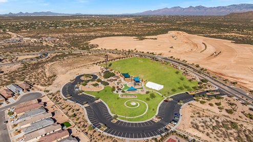 Welcome to The Oasis at Rocking K, a premier D.R. Horton new home community nestled in the picturesque landscapes of Vail, Arizona, where new homes blend seamlessly with the breathtaking surroundings of the Rincon Mountains. Experience the perfect balance of tranquility and modern convenience in this master-planned neighborhood, designed to offer a lifestyle that caters to families, nature enthusiasts, and anyone seeking a peaceful yet connected community. The Oasis at Rocking K features five beautifully designed one-story floor plans ranging from 1,400 to 1,900 square feet, each crafted with the high-quality features and finishes D.R. Horton is known for. Homes in Rocking K feature a Spanish lace stucco exterior, tile roofs, and meticulously landscaped front yards with auto drip irrigation. Inside, you’ll find luxurious quartz countertops in the kitchens and bathrooms, 42” shaker-style cabinets with modern cabinet pulls, and wood-look tile flooring throughout the main living areas. Homes also include covered front porches and back patios, perfect for enjoying Arizona’s stunning sunsets and clear night skies. Each home in The Oasis at Rocking K is equipped with D.R. Horton’s Home is Connected® Smart Home package, which includes a smart thermostat, video doorbell, keyless entry, Wi-Fi-enabled garage door opener, and Deako light switches. Additionally, these homes meet the stringent DOE Zero Energy Ready Home standards, making them not only comfortable and modern but also exceptionally energy-efficient. With features like spray foam insulation, tankless water heaters and LED lighting, these homes are designed to reduce your environmental footprint and provide long-term savings on energy costs. Living at Rocking K means being part of a vibrant, family-oriented community with a strong sense of connection among residents. The Oasis at Rocking K offers a variety of amenities, including ramadas, picnic tables, and grassy areas perfect for gatherings. Residents also have access to the greater Rocking K master-planned neighborhood amenities, such as a splashpad, large event lawn, walking paths, multipurpose fields, basketball and pickleball courts, and an innovative playground with a zip-line and jungle gym. The new K-8 school, set to open in 2025, is just one of the many features that make Rocking K ideal for families. Life at Rocking K is further enriched by a lively calendar of lifestyle events, thoughtfully organized by the Rocking K Homeowners Association. These events are a cornerstone of community life, fostering a strong sense of connection among residents. Whether you’re looking to enjoy a quiet evening star gazing in the park or engage in fun activities with neighbors, there’s always something happening. The quarterly lifestyle calendar is packed with regular and seasonal events, including movie nights in the park, sports and summer camps for kids, and wine tasting events for adults. Families can join hiking groups, participate in trivia nights, or enjoy the various holiday celebrations. The community comes alive during the holidays with loads of themed events, arts and crafts fairs, and car shows. Rocking K’s commitment to providing a dynamic and engaging environment ensures that there’s always an opportunity to make memories and build lasting friendships right in your neighborhood. Residents of Rocking K benefit from easy access to I-10, making commutes to Tucson and surrounding areas a breeze. The community is close to major employers such as Davis-Monthan Air Force Base, Raytheon, and the University of Arizona, as well as top-notch healthcare facilities like TMC Rincon and Northwest Hospital East. The nearby Houghton Town Center and Houghton Rd. business corridor offer convenient shopping, dining, and services. For outdoor enthusiasts, Rocking K is surrounded by natural beauty and recreational opportunities. Explore the hiking and biking trails at Colossal Cave Mountain Park, Saguaro National Park East, and the Arizona Trail. Enjoy golfing at Del Lago Golf Course, or take a short drive to Sonoita for a day trip to Arizona’s Wine Country. Whether it’s hiking, camping, or simply taking in the stunning views, Rocking K is your gateway to the great outdoors. With 360-degree mountain views, calm and quiet evenings, and a location that’s close to everything you need, Rocking K is truly a community where you can thrive. Experience the best of Arizona living at The Oasis at Rocking K, where your new home awaits in a community that offers everything you need for a fulfilling lifestyle.