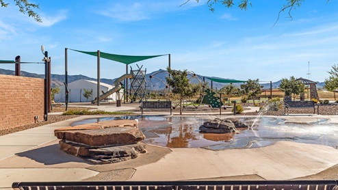 Welcome to The Oasis at Rocking K, a premier D.R. Horton new home community nestled in the picturesque landscapes of Vail, Arizona, where new homes blend seamlessly with the breathtaking surroundings of the Rincon Mountains. Experience the perfect balance of tranquility and modern convenience in this master-planned neighborhood, designed to offer a lifestyle that caters to families, nature enthusiasts, and anyone seeking a peaceful yet connected community. The Oasis at Rocking K features five beautifully designed one-story floor plans ranging from 1,400 to 1,900 square feet, each crafted with the high-quality features and finishes D.R. Horton is known for. Homes in Rocking K feature a Spanish lace stucco exterior, tile roofs, and meticulously landscaped front yards with auto drip irrigation. Inside, you’ll find luxurious quartz countertops in the kitchens and bathrooms, 42” shaker-style cabinets with modern cabinet pulls, and wood-look tile flooring throughout the main living areas. Homes also include covered front porches and back patios, perfect for enjoying Arizona’s stunning sunsets and clear night skies. Each home in The Oasis at Rocking K is equipped with D.R. Horton’s Home is Connected® Smart Home package, which includes a smart thermostat, video doorbell, keyless entry, Wi-Fi-enabled garage door opener, and Deako light switches. Additionally, these homes meet the stringent DOE Zero Energy Ready Home standards, making them not only comfortable and modern but also exceptionally energy-efficient. With features like spray foam insulation, tankless water heaters and LED lighting, these homes are designed to reduce your environmental footprint and provide long-term savings on energy costs. Living at Rocking K means being part of a vibrant, family-oriented community with a strong sense of connection among residents. The Oasis at Rocking K offers a variety of amenities, including ramadas, picnic tables, and grassy areas perfect for gatherings. Residents also have access to the greater Rocking K master-planned neighborhood amenities, such as a splashpad, large event lawn, walking paths, multipurpose fields, basketball and pickleball courts, and an innovative playground with a zip-line and jungle gym. The new K-8 school, set to open in 2025, is just one of the many features that make Rocking K ideal for families. Life at Rocking K is further enriched by a lively calendar of lifestyle events, thoughtfully organized by the Rocking K Homeowners Association. These events are a cornerstone of community life, fostering a strong sense of connection among residents. Whether you’re looking to enjoy a quiet evening star gazing in the park or engage in fun activities with neighbors, there’s always something happening. The quarterly lifestyle calendar is packed with regular and seasonal events, including movie nights in the park, sports and summer camps for kids, and wine tasting events for adults. Families can join hiking groups, participate in trivia nights, or enjoy the various holiday celebrations. The community comes alive during the holidays with loads of themed events, arts and crafts fairs, and car shows. Rocking K’s commitment to providing a dynamic and engaging environment ensures that there’s always an opportunity to make memories and build lasting friendships right in your neighborhood. Residents of Rocking K benefit from easy access to I-10, making commutes to Tucson and surrounding areas a breeze. The community is close to major employers such as Davis-Monthan Air Force Base, Raytheon, and the University of Arizona, as well as top-notch healthcare facilities like TMC Rincon and Northwest Hospital East. The nearby Houghton Town Center and Houghton Rd. business corridor offer convenient shopping, dining, and services. For outdoor enthusiasts, Rocking K is surrounded by natural beauty and recreational opportunities. Explore the hiking and biking trails at Colossal Cave Mountain Park, Saguaro National Park East, and the Arizona Trail. Enjoy golfing at Del Lago Golf Course, or take a short drive to Sonoita for a day trip to Arizona’s Wine Country. Whether it’s hiking, camping, or simply taking in the stunning views, Rocking K is your gateway to the great outdoors. With 360-degree mountain views, calm and quiet evenings, and a location that’s close to everything you need, Rocking K is truly a community where you can thrive. Experience the best of Arizona living at The Oasis at Rocking K, where your new home awaits in a community that offers everything you need for a fulfilling lifestyle.