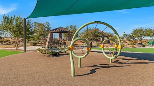 Welcome to The Oasis at Rocking K, a premier D.R. Horton new home community nestled in the picturesque landscapes of Vail, Arizona, where new homes blend seamlessly with the breathtaking surroundings of the Rincon Mountains. Experience the perfect balance of tranquility and modern convenience in this master-planned neighborhood, designed to offer a lifestyle that caters to families, nature enthusiasts, and anyone seeking a peaceful yet connected community. The Oasis at Rocking K features five beautifully designed one-story floor plans ranging from 1,400 to 1,900 square feet, each crafted with the high-quality features and finishes D.R. Horton is known for. Homes in Rocking K feature a Spanish lace stucco exterior, tile roofs, and meticulously landscaped front yards with auto drip irrigation. Inside, you’ll find luxurious quartz countertops in the kitchens and bathrooms, 42” shaker-style cabinets with modern cabinet pulls, and wood-look tile flooring throughout the main living areas. Homes also include covered front porches and back patios, perfect for enjoying Arizona’s stunning sunsets and clear night skies. Each home in The Oasis at Rocking K is equipped with D.R. Horton’s Home is Connected® Smart Home package, which includes a smart thermostat, video doorbell, keyless entry, Wi-Fi-enabled garage door opener, and Deako light switches. Additionally, these homes meet the stringent DOE Zero Energy Ready Home standards, making them not only comfortable and modern but also exceptionally energy-efficient. With features like spray foam insulation, tankless water heaters and LED lighting, these homes are designed to reduce your environmental footprint and provide long-term savings on energy costs. Living at Rocking K means being part of a vibrant, family-oriented community with a strong sense of connection among residents. The Oasis at Rocking K offers a variety of amenities, including ramadas, picnic tables, and grassy areas perfect for gatherings. Residents also have access to the greater Rocking K master-planned neighborhood amenities, such as a splashpad, large event lawn, walking paths, multipurpose fields, basketball and pickleball courts, and an innovative playground with a zip-line and jungle gym. The new K-8 school, set to open in 2025, is just one of the many features that make Rocking K ideal for families. Life at Rocking K is further enriched by a lively calendar of lifestyle events, thoughtfully organized by the Rocking K Homeowners Association. These events are a cornerstone of community life, fostering a strong sense of connection among residents. Whether you’re looking to enjoy a quiet evening star gazing in the park or engage in fun activities with neighbors, there’s always something happening. The quarterly lifestyle calendar is packed with regular and seasonal events, including movie nights in the park, sports and summer camps for kids, and wine tasting events for adults. Families can join hiking groups, participate in trivia nights, or enjoy the various holiday celebrations. The community comes alive during the holidays with loads of themed events, arts and crafts fairs, and car shows. Rocking K’s commitment to providing a dynamic and engaging environment ensures that there’s always an opportunity to make memories and build lasting friendships right in your neighborhood. Residents of Rocking K benefit from easy access to I-10, making commutes to Tucson and surrounding areas a breeze. The community is close to major employers such as Davis-Monthan Air Force Base, Raytheon, and the University of Arizona, as well as top-notch healthcare facilities like TMC Rincon and Northwest Hospital East. The nearby Houghton Town Center and Houghton Rd. business corridor offer convenient shopping, dining, and services. For outdoor enthusiasts, Rocking K is surrounded by natural beauty and recreational opportunities. Explore the hiking and biking trails at Colossal Cave Mountain Park, Saguaro National Park East, and the Arizona Trail. Enjoy golfing at Del Lago Golf Course, or take a short drive to Sonoita for a day trip to Arizona’s Wine Country. Whether it’s hiking, camping, or simply taking in the stunning views, Rocking K is your gateway to the great outdoors. With 360-degree mountain views, calm and quiet evenings, and a location that’s close to everything you need, Rocking K is truly a community where you can thrive. Experience the best of Arizona living at The Oasis at Rocking K, where your new home awaits in a community that offers everything you need for a fulfilling lifestyle.