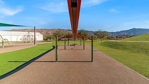 Welcome to The Oasis at Rocking K, a premier D.R. Horton new home community nestled in the picturesque landscapes of Vail, Arizona, where new homes blend seamlessly with the breathtaking surroundings of the Rincon Mountains. Experience the perfect balance of tranquility and modern convenience in this master-planned neighborhood, designed to offer a lifestyle that caters to families, nature enthusiasts, and anyone seeking a peaceful yet connected community. The Oasis at Rocking K features five beautifully designed one-story floor plans ranging from 1,400 to 1,900 square feet, each crafted with the high-quality features and finishes D.R. Horton is known for. Homes in Rocking K feature a Spanish lace stucco exterior, tile roofs, and meticulously landscaped front yards with auto drip irrigation. Inside, you’ll find luxurious quartz countertops in the kitchens and bathrooms, 42” shaker-style cabinets with modern cabinet pulls, and wood-look tile flooring throughout the main living areas. Homes also include covered front porches and back patios, perfect for enjoying Arizona’s stunning sunsets and clear night skies. Each home in The Oasis at Rocking K is equipped with D.R. Horton’s Home is Connected® Smart Home package, which includes a smart thermostat, video doorbell, keyless entry, Wi-Fi-enabled garage door opener, and Deako light switches. Additionally, these homes meet the stringent DOE Zero Energy Ready Home standards, making them not only comfortable and modern but also exceptionally energy-efficient. With features like spray foam insulation, tankless water heaters and LED lighting, these homes are designed to reduce your environmental footprint and provide long-term savings on energy costs. Living at Rocking K means being part of a vibrant, family-oriented community with a strong sense of connection among residents. The Oasis at Rocking K offers a variety of amenities, including ramadas, picnic tables, and grassy areas perfect for gatherings. Residents also have access to the greater Rocking K master-planned neighborhood amenities, such as a splashpad, large event lawn, walking paths, multipurpose fields, basketball and pickleball courts, and an innovative playground with a zip-line and jungle gym. The new K-8 school, set to open in 2025, is just one of the many features that make Rocking K ideal for families. Life at Rocking K is further enriched by a lively calendar of lifestyle events, thoughtfully organized by the Rocking K Homeowners Association. These events are a cornerstone of community life, fostering a strong sense of connection among residents. Whether you’re looking to enjoy a quiet evening star gazing in the park or engage in fun activities with neighbors, there’s always something happening. The quarterly lifestyle calendar is packed with regular and seasonal events, including movie nights in the park, sports and summer camps for kids, and wine tasting events for adults. Families can join hiking groups, participate in trivia nights, or enjoy the various holiday celebrations. The community comes alive during the holidays with loads of themed events, arts and crafts fairs, and car shows. Rocking K’s commitment to providing a dynamic and engaging environment ensures that there’s always an opportunity to make memories and build lasting friendships right in your neighborhood. Residents of Rocking K benefit from easy access to I-10, making commutes to Tucson and surrounding areas a breeze. The community is close to major employers such as Davis-Monthan Air Force Base, Raytheon, and the University of Arizona, as well as top-notch healthcare facilities like TMC Rincon and Northwest Hospital East. The nearby Houghton Town Center and Houghton Rd. business corridor offer convenient shopping, dining, and services. For outdoor enthusiasts, Rocking K is surrounded by natural beauty and recreational opportunities. Explore the hiking and biking trails at Colossal Cave Mountain Park, Saguaro National Park East, and the Arizona Trail. Enjoy golfing at Del Lago Golf Course, or take a short drive to Sonoita for a day trip to Arizona’s Wine Country. Whether it’s hiking, camping, or simply taking in the stunning views, Rocking K is your gateway to the great outdoors. With 360-degree mountain views, calm and quiet evenings, and a location that’s close to everything you need, Rocking K is truly a community where you can thrive. Experience the best of Arizona living at The Oasis at Rocking K, where your new home awaits in a community that offers everything you need for a fulfilling lifestyle.