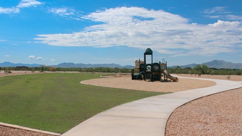 Discover the new homes at Hanson Ridge, a peaceful D.R. Horton community located in the scenic town of Vail, Arizona. Tucked away from the hustle and bustle of city life, Hanson Ridge offers a serene lifestyle with incredible desert landscapes and mountain views, while still providing easy access to I-10, making commutes to Tucson and surrounding areas convenient. Whether you’re seeking tranquility or proximity to modern conveniences, Hanson Ridge delivers the best of both worlds. This thoughtfully planned community features a variety of spacious one- and two-story homes, ranging from 1,300 to 2,500 square feet, designed to accommodate diverse lifestyles. Each home at Hanson Ridge is equipped with high-quality features, including granite countertops in the kitchens and bathrooms, 42" shaker-style cabinets, and beautiful 18"x18" tile flooring. The homes also feature covered front porches and back patios, providing the perfect spaces to enjoy Arizona’s beautiful weather. The community is designed with spacious lots, and generous pool-ready backyards, giving you the flexibility to customize your own outdoor oasis. Hanson Ridge is built with energy efficiency in mind, meeting the DOE Zero Energy Ready Home standards. These high-performance homes are so energy-efficient that a renewable energy system could offset most or all of the home's annual energy use. With advanced features such as a tankless water heater, energy-efficient LED lighting, a smart thermostat and more, these homes offer both comfort and sustainability. Additionally, the Home is Connected® Smart Home package built into every home includes a video doorbell, keyless entry, Deako smart switches a Wi-Fi-enabled garage door opener and more, ensuring that modern convenience is at your fingertips whether you're at home or away. Residents of Hanson Ridge enjoy a strong sense of community, with parks, walking paths, and playgrounds sprinkled throughout the neighborhood, fostering connections among families and neighbors. The Vail Unified School District, renowned for its exceptional educational standards, serves this community, with Acacia Elementary School, Old Vail Middle School, and Cienega High School all located nearby. The location of Hanson Ridge provides residents with easy access to a variety of outdoor and recreational activities. Explore the nearby Rincon Mountains, hike through Saguaro National Park, or visit Colossal Cave Mountain Park and Cienega Creek Natural Preserve. For those who enjoy golfing, Del Lago Golf Course is just minutes away. The community’s proximity to major employers such as Raytheon, UA Tech Park, Davis-Monthan Air Force Base, and the Target Distribution Center makes it an ideal choice for working professionals. In addition to its natural beauty and recreational offerings, Hanson Ridge is just a short drive from the town center, where you’ll find shopping, dining, and entertainment options. Visit the Pima County Fairgrounds, enjoy a movie at Galaxy Theatres, or explore the historic Cienega Bridge landmark. For a weekend getaway, Sonoita’s Wine Country is just 30 minutes away, offering cooler climates, picturesque vineyards, and outdoor adventures. Hanson Ridge offers a unique blend of peaceful, rural living with the convenience of nearby urban amenities. Experience the charm and comfort of Hanson Ridge, where your new home awaits.