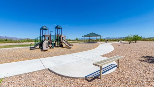 Discover the new homes at Hanson Ridge, a peaceful D.R. Horton community located in the scenic town of Vail, Arizona. Tucked away from the hustle and bustle of city life, Hanson Ridge offers a serene lifestyle with incredible desert landscapes and mountain views, while still providing easy access to I-10, making commutes to Tucson and surrounding areas convenient. Whether you’re seeking tranquility or proximity to modern conveniences, Hanson Ridge delivers the best of both worlds. This thoughtfully planned community features a variety of spacious one- and two-story homes, ranging from 1,300 to 2,500 square feet, designed to accommodate diverse lifestyles. Each home at Hanson Ridge is equipped with high-quality features, including granite countertops in the kitchens and bathrooms, 42" shaker-style cabinets, and beautiful 18"x18" tile flooring. The homes also feature covered front porches and back patios, providing the perfect spaces to enjoy Arizona’s beautiful weather. The community is designed with spacious lots, and generous pool-ready backyards, giving you the flexibility to customize your own outdoor oasis. Hanson Ridge is built with energy efficiency in mind, meeting the DOE Zero Energy Ready Home standards. These high-performance homes are so energy-efficient that a renewable energy system could offset most or all of the home's annual energy use. With advanced features such as a tankless water heater, energy-efficient LED lighting, a smart thermostat and more, these homes offer both comfort and sustainability. Additionally, the Home is Connected® Smart Home package built into every home includes a video doorbell, keyless entry, Deako smart switches a Wi-Fi-enabled garage door opener and more, ensuring that modern convenience is at your fingertips whether you're at home or away. Residents of Hanson Ridge enjoy a strong sense of community, with parks, walking paths, and playgrounds sprinkled throughout the neighborhood, fostering connections among families and neighbors. The Vail Unified School District, renowned for its exceptional educational standards, serves this community, with Acacia Elementary School, Old Vail Middle School, and Cienega High School all located nearby. The location of Hanson Ridge provides residents with easy access to a variety of outdoor and recreational activities. Explore the nearby Rincon Mountains, hike through Saguaro National Park, or visit Colossal Cave Mountain Park and Cienega Creek Natural Preserve. For those who enjoy golfing, Del Lago Golf Course is just minutes away. The community’s proximity to major employers such as Raytheon, UA Tech Park, Davis-Monthan Air Force Base, and the Target Distribution Center makes it an ideal choice for working professionals. In addition to its natural beauty and recreational offerings, Hanson Ridge is just a short drive from the town center, where you’ll find shopping, dining, and entertainment options. Visit the Pima County Fairgrounds, enjoy a movie at Galaxy Theatres, or explore the historic Cienega Bridge landmark. For a weekend getaway, Sonoita’s Wine Country is just 30 minutes away, offering cooler climates, picturesque vineyards, and outdoor adventures. Hanson Ridge offers a unique blend of peaceful, rural living with the convenience of nearby urban amenities. Experience the charm and comfort of Hanson Ridge, where your new home awaits.