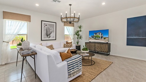Discover the new homes at Hanson Ridge, a peaceful D.R. Horton community located in the scenic town of Vail, Arizona. Tucked away from the hustle and bustle of city life, Hanson Ridge offers a serene lifestyle with incredible desert landscapes and mountain views, while still providing easy access to I-10, making commutes to Tucson and surrounding areas convenient. Whether you’re seeking tranquility or proximity to modern conveniences, Hanson Ridge delivers the best of both worlds. This thoughtfully planned community features a variety of spacious one- and two-story homes, ranging from 1,300 to 2,500 square feet, designed to accommodate diverse lifestyles. Each home at Hanson Ridge is equipped with high-quality features, including granite countertops in the kitchens and bathrooms, 42" shaker-style cabinets, and beautiful 18"x18" tile flooring. The homes also feature covered front porches and back patios, providing the perfect spaces to enjoy Arizona’s beautiful weather. The community is designed with spacious lots, and generous pool-ready backyards, giving you the flexibility to customize your own outdoor oasis. Hanson Ridge is built with energy efficiency in mind, meeting the DOE Zero Energy Ready Home standards. These high-performance homes are so energy-efficient that a renewable energy system could offset most or all of the home's annual energy use. With advanced features such as a tankless water heater, energy-efficient LED lighting, a smart thermostat and more, these homes offer both comfort and sustainability. Additionally, the Home is Connected® Smart Home package built into every home includes a video doorbell, keyless entry, Deako smart switches a Wi-Fi-enabled garage door opener and more, ensuring that modern convenience is at your fingertips whether you're at home or away. Residents of Hanson Ridge enjoy a strong sense of community, with parks, walking paths, and playgrounds sprinkled throughout the neighborhood, fostering connections among families and neighbors. The Vail Unified School District, renowned for its exceptional educational standards, serves this community, with Acacia Elementary School, Old Vail Middle School, and Cienega High School all located nearby. The location of Hanson Ridge provides residents with easy access to a variety of outdoor and recreational activities. Explore the nearby Rincon Mountains, hike through Saguaro National Park, or visit Colossal Cave Mountain Park and Cienega Creek Natural Preserve. For those who enjoy golfing, Del Lago Golf Course is just minutes away. The community’s proximity to major employers such as Raytheon, UA Tech Park, Davis-Monthan Air Force Base, and the Target Distribution Center makes it an ideal choice for working professionals. In addition to its natural beauty and recreational offerings, Hanson Ridge is just a short drive from the town center, where you’ll find shopping, dining, and entertainment options. Visit the Pima County Fairgrounds, enjoy a movie at Galaxy Theatres, or explore the historic Cienega Bridge landmark. For a weekend getaway, Sonoita’s Wine Country is just 30 minutes away, offering cooler climates, picturesque vineyards, and outdoor adventures. Hanson Ridge offers a unique blend of peaceful, rural living with the convenience of nearby urban amenities. Experience the charm and comfort of Hanson Ridge, where your new home awaits.
