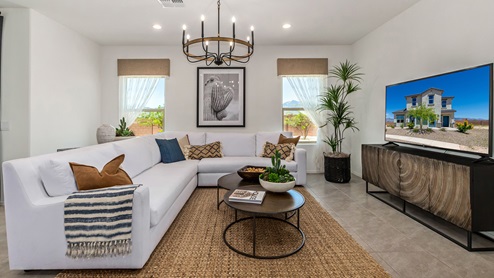 Discover the new homes at Hanson Ridge, a peaceful D.R. Horton community located in the scenic town of Vail, Arizona. Tucked away from the hustle and bustle of city life, Hanson Ridge offers a serene lifestyle with incredible desert landscapes and mountain views, while still providing easy access to I-10, making commutes to Tucson and surrounding areas convenient. Whether you’re seeking tranquility or proximity to modern conveniences, Hanson Ridge delivers the best of both worlds. This thoughtfully planned community features a variety of spacious one- and two-story homes, ranging from 1,300 to 2,500 square feet, designed to accommodate diverse lifestyles. Each home at Hanson Ridge is equipped with high-quality features, including granite countertops in the kitchens and bathrooms, 42" shaker-style cabinets, and beautiful 18"x18" tile flooring. The homes also feature covered front porches and back patios, providing the perfect spaces to enjoy Arizona’s beautiful weather. The community is designed with spacious lots, and generous pool-ready backyards, giving you the flexibility to customize your own outdoor oasis. Hanson Ridge is built with energy efficiency in mind, meeting the DOE Zero Energy Ready Home standards. These high-performance homes are so energy-efficient that a renewable energy system could offset most or all of the home's annual energy use. With advanced features such as a tankless water heater, energy-efficient LED lighting, a smart thermostat and more, these homes offer both comfort and sustainability. Additionally, the Home is Connected® Smart Home package built into every home includes a video doorbell, keyless entry, Deako smart switches a Wi-Fi-enabled garage door opener and more, ensuring that modern convenience is at your fingertips whether you're at home or away. Residents of Hanson Ridge enjoy a strong sense of community, with parks, walking paths, and playgrounds sprinkled throughout the neighborhood, fostering connections among families and neighbors. The Vail Unified School District, renowned for its exceptional educational standards, serves this community, with Acacia Elementary School, Old Vail Middle School, and Cienega High School all located nearby. The location of Hanson Ridge provides residents with easy access to a variety of outdoor and recreational activities. Explore the nearby Rincon Mountains, hike through Saguaro National Park, or visit Colossal Cave Mountain Park and Cienega Creek Natural Preserve. For those who enjoy golfing, Del Lago Golf Course is just minutes away. The community’s proximity to major employers such as Raytheon, UA Tech Park, Davis-Monthan Air Force Base, and the Target Distribution Center makes it an ideal choice for working professionals. In addition to its natural beauty and recreational offerings, Hanson Ridge is just a short drive from the town center, where you’ll find shopping, dining, and entertainment options. Visit the Pima County Fairgrounds, enjoy a movie at Galaxy Theatres, or explore the historic Cienega Bridge landmark. For a weekend getaway, Sonoita’s Wine Country is just 30 minutes away, offering cooler climates, picturesque vineyards, and outdoor adventures. Hanson Ridge offers a unique blend of peaceful, rural living with the convenience of nearby urban amenities. Experience the charm and comfort of Hanson Ridge, where your new home awaits.