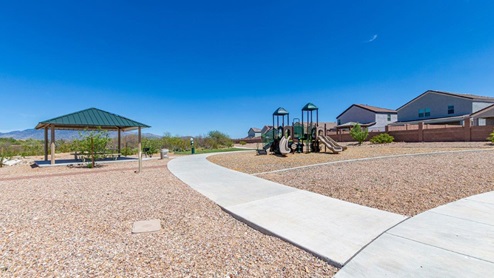 Discover the new homes at Hanson Ridge, a peaceful D.R. Horton community located in the scenic town of Vail, Arizona. Tucked away from the hustle and bustle of city life, Hanson Ridge offers a serene lifestyle with incredible desert landscapes and mountain views, while still providing easy access to I-10, making commutes to Tucson and surrounding areas convenient. Whether you’re seeking tranquility or proximity to modern conveniences, Hanson Ridge delivers the best of both worlds. This thoughtfully planned community features a variety of spacious one- and two-story homes, ranging from 1,300 to 2,500 square feet, designed to accommodate diverse lifestyles. Each home at Hanson Ridge is equipped with high-quality features, including granite countertops in the kitchens and bathrooms, 42" shaker-style cabinets, and beautiful 18"x18" tile flooring. The homes also feature covered front porches and back patios, providing the perfect spaces to enjoy Arizona’s beautiful weather. The community is designed with spacious lots, and generous pool-ready backyards, giving you the flexibility to customize your own outdoor oasis. Hanson Ridge is built with energy efficiency in mind, meeting the DOE Zero Energy Ready Home standards. These high-performance homes are so energy-efficient that a renewable energy system could offset most or all of the home's annual energy use. With advanced features such as a tankless water heater, energy-efficient LED lighting, a smart thermostat and more, these homes offer both comfort and sustainability. Additionally, the Home is Connected® Smart Home package built into every home includes a video doorbell, keyless entry, Deako smart switches a Wi-Fi-enabled garage door opener and more, ensuring that modern convenience is at your fingertips whether you're at home or away. Residents of Hanson Ridge enjoy a strong sense of community, with parks, walking paths, and playgrounds sprinkled throughout the neighborhood, fostering connections among families and neighbors. The Vail Unified School District, renowned for its exceptional educational standards, serves this community, with Acacia Elementary School, Old Vail Middle School, and Cienega High School all located nearby. The location of Hanson Ridge provides residents with easy access to a variety of outdoor and recreational activities. Explore the nearby Rincon Mountains, hike through Saguaro National Park, or visit Colossal Cave Mountain Park and Cienega Creek Natural Preserve. For those who enjoy golfing, Del Lago Golf Course is just minutes away. The community’s proximity to major employers such as Raytheon, UA Tech Park, Davis-Monthan Air Force Base, and the Target Distribution Center makes it an ideal choice for working professionals. In addition to its natural beauty and recreational offerings, Hanson Ridge is just a short drive from the town center, where you’ll find shopping, dining, and entertainment options. Visit the Pima County Fairgrounds, enjoy a movie at Galaxy Theatres, or explore the historic Cienega Bridge landmark. For a weekend getaway, Sonoita’s Wine Country is just 30 minutes away, offering cooler climates, picturesque vineyards, and outdoor adventures. Hanson Ridge offers a unique blend of peaceful, rural living with the convenience of nearby urban amenities. Experience the charm and comfort of Hanson Ridge, where your new home awaits.