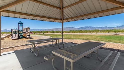 Discover the new homes at Hanson Ridge, a peaceful D.R. Horton community located in the scenic town of Vail, Arizona. Tucked away from the hustle and bustle of city life, Hanson Ridge offers a serene lifestyle with incredible desert landscapes and mountain views, while still providing easy access to I-10, making commutes to Tucson and surrounding areas convenient. Whether you’re seeking tranquility or proximity to modern conveniences, Hanson Ridge delivers the best of both worlds. This thoughtfully planned community features a variety of spacious one- and two-story homes, ranging from 1,300 to 2,500 square feet, designed to accommodate diverse lifestyles. Each home at Hanson Ridge is equipped with high-quality features, including granite countertops in the kitchens and bathrooms, 42" shaker-style cabinets, and beautiful 18"x18" tile flooring. The homes also feature covered front porches and back patios, providing the perfect spaces to enjoy Arizona’s beautiful weather. The community is designed with spacious lots, and generous pool-ready backyards, giving you the flexibility to customize your own outdoor oasis. Hanson Ridge is built with energy efficiency in mind, meeting the DOE Zero Energy Ready Home standards. These high-performance homes are so energy-efficient that a renewable energy system could offset most or all of the home's annual energy use. With advanced features such as a tankless water heater, energy-efficient LED lighting, a smart thermostat and more, these homes offer both comfort and sustainability. Additionally, the Home is Connected® Smart Home package built into every home includes a video doorbell, keyless entry, Deako smart switches a Wi-Fi-enabled garage door opener and more, ensuring that modern convenience is at your fingertips whether you're at home or away. Residents of Hanson Ridge enjoy a strong sense of community, with parks, walking paths, and playgrounds sprinkled throughout the neighborhood, fostering connections among families and neighbors. The Vail Unified School District, renowned for its exceptional educational standards, serves this community, with Acacia Elementary School, Old Vail Middle School, and Cienega High School all located nearby. The location of Hanson Ridge provides residents with easy access to a variety of outdoor and recreational activities. Explore the nearby Rincon Mountains, hike through Saguaro National Park, or visit Colossal Cave Mountain Park and Cienega Creek Natural Preserve. For those who enjoy golfing, Del Lago Golf Course is just minutes away. The community’s proximity to major employers such as Raytheon, UA Tech Park, Davis-Monthan Air Force Base, and the Target Distribution Center makes it an ideal choice for working professionals. In addition to its natural beauty and recreational offerings, Hanson Ridge is just a short drive from the town center, where you’ll find shopping, dining, and entertainment options. Visit the Pima County Fairgrounds, enjoy a movie at Galaxy Theatres, or explore the historic Cienega Bridge landmark. For a weekend getaway, Sonoita’s Wine Country is just 30 minutes away, offering cooler climates, picturesque vineyards, and outdoor adventures. Hanson Ridge offers a unique blend of peaceful, rural living with the convenience of nearby urban amenities. Experience the charm and comfort of Hanson Ridge, where your new home awaits.