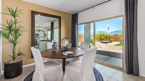 Discover the new homes at Hanson Ridge, a peaceful D.R. Horton community located in the scenic town of Vail, Arizona. Tucked away from the hustle and bustle of city life, Hanson Ridge offers a serene lifestyle with incredible desert landscapes and mountain views, while still providing easy access to I-10, making commutes to Tucson and surrounding areas convenient. Whether you’re seeking tranquility or proximity to modern conveniences, Hanson Ridge delivers the best of both worlds. This thoughtfully planned community features a variety of spacious one- and two-story homes, ranging from 1,300 to 2,500 square feet, designed to accommodate diverse lifestyles. Each home at Hanson Ridge is equipped with high-quality features, including granite countertops in the kitchens and bathrooms, 42" shaker-style cabinets, and beautiful 18"x18" tile flooring. The homes also feature covered front porches and back patios, providing the perfect spaces to enjoy Arizona’s beautiful weather. The community is designed with spacious lots, and generous pool-ready backyards, giving you the flexibility to customize your own outdoor oasis. Hanson Ridge is built with energy efficiency in mind, meeting the DOE Zero Energy Ready Home standards. These high-performance homes are so energy-efficient that a renewable energy system could offset most or all of the home's annual energy use. With advanced features such as a tankless water heater, energy-efficient LED lighting, a smart thermostat and more, these homes offer both comfort and sustainability. Additionally, the Home is Connected® Smart Home package built into every home includes a video doorbell, keyless entry, Deako smart switches a Wi-Fi-enabled garage door opener and more, ensuring that modern convenience is at your fingertips whether you're at home or away. Residents of Hanson Ridge enjoy a strong sense of community, with parks, walking paths, and playgrounds sprinkled throughout the neighborhood, fostering connections among families and neighbors. The Vail Unified School District, renowned for its exceptional educational standards, serves this community, with Acacia Elementary School, Old Vail Middle School, and Cienega High School all located nearby. The location of Hanson Ridge provides residents with easy access to a variety of outdoor and recreational activities. Explore the nearby Rincon Mountains, hike through Saguaro National Park, or visit Colossal Cave Mountain Park and Cienega Creek Natural Preserve. For those who enjoy golfing, Del Lago Golf Course is just minutes away. The community’s proximity to major employers such as Raytheon, UA Tech Park, Davis-Monthan Air Force Base, and the Target Distribution Center makes it an ideal choice for working professionals. In addition to its natural beauty and recreational offerings, Hanson Ridge is just a short drive from the town center, where you’ll find shopping, dining, and entertainment options. Visit the Pima County Fairgrounds, enjoy a movie at Galaxy Theatres, or explore the historic Cienega Bridge landmark. For a weekend getaway, Sonoita’s Wine Country is just 30 minutes away, offering cooler climates, picturesque vineyards, and outdoor adventures. Hanson Ridge offers a unique blend of peaceful, rural living with the convenience of nearby urban amenities. Experience the charm and comfort of Hanson Ridge, where your new home awaits.