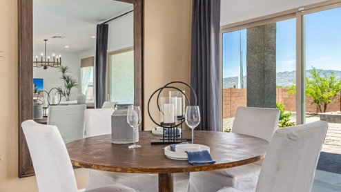Discover the new homes at Hanson Ridge, a peaceful D.R. Horton community located in the scenic town of Vail, Arizona. Tucked away from the hustle and bustle of city life, Hanson Ridge offers a serene lifestyle with incredible desert landscapes and mountain views, while still providing easy access to I-10, making commutes to Tucson and surrounding areas convenient. Whether you’re seeking tranquility or proximity to modern conveniences, Hanson Ridge delivers the best of both worlds. This thoughtfully planned community features a variety of spacious one- and two-story homes, ranging from 1,300 to 2,500 square feet, designed to accommodate diverse lifestyles. Each home at Hanson Ridge is equipped with high-quality features, including granite countertops in the kitchens and bathrooms, 42" shaker-style cabinets, and beautiful 18"x18" tile flooring. The homes also feature covered front porches and back patios, providing the perfect spaces to enjoy Arizona’s beautiful weather. The community is designed with spacious lots, and generous pool-ready backyards, giving you the flexibility to customize your own outdoor oasis. Hanson Ridge is built with energy efficiency in mind, meeting the DOE Zero Energy Ready Home standards. These high-performance homes are so energy-efficient that a renewable energy system could offset most or all of the home's annual energy use. With advanced features such as a tankless water heater, energy-efficient LED lighting, a smart thermostat and more, these homes offer both comfort and sustainability. Additionally, the Home is Connected® Smart Home package built into every home includes a video doorbell, keyless entry, Deako smart switches a Wi-Fi-enabled garage door opener and more, ensuring that modern convenience is at your fingertips whether you're at home or away. Residents of Hanson Ridge enjoy a strong sense of community, with parks, walking paths, and playgrounds sprinkled throughout the neighborhood, fostering connections among families and neighbors. The Vail Unified School District, renowned for its exceptional educational standards, serves this community, with Acacia Elementary School, Old Vail Middle School, and Cienega High School all located nearby. The location of Hanson Ridge provides residents with easy access to a variety of outdoor and recreational activities. Explore the nearby Rincon Mountains, hike through Saguaro National Park, or visit Colossal Cave Mountain Park and Cienega Creek Natural Preserve. For those who enjoy golfing, Del Lago Golf Course is just minutes away. The community’s proximity to major employers such as Raytheon, UA Tech Park, Davis-Monthan Air Force Base, and the Target Distribution Center makes it an ideal choice for working professionals. In addition to its natural beauty and recreational offerings, Hanson Ridge is just a short drive from the town center, where you’ll find shopping, dining, and entertainment options. Visit the Pima County Fairgrounds, enjoy a movie at Galaxy Theatres, or explore the historic Cienega Bridge landmark. For a weekend getaway, Sonoita’s Wine Country is just 30 minutes away, offering cooler climates, picturesque vineyards, and outdoor adventures. Hanson Ridge offers a unique blend of peaceful, rural living with the convenience of nearby urban amenities. Experience the charm and comfort of Hanson Ridge, where your new home awaits.