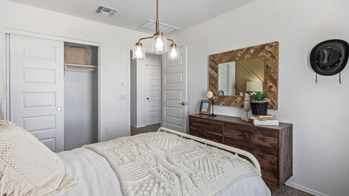 Discover the new homes at Hanson Ridge, a peaceful D.R. Horton community located in the scenic town of Vail, Arizona. Tucked away from the hustle and bustle of city life, Hanson Ridge offers a serene lifestyle with incredible desert landscapes and mountain views, while still providing easy access to I-10, making commutes to Tucson and surrounding areas convenient. Whether you’re seeking tranquility or proximity to modern conveniences, Hanson Ridge delivers the best of both worlds. This thoughtfully planned community features a variety of spacious one- and two-story homes, ranging from 1,300 to 2,500 square feet, designed to accommodate diverse lifestyles. Each home at Hanson Ridge is equipped with high-quality features, including granite countertops in the kitchens and bathrooms, 42" shaker-style cabinets, and beautiful 18"x18" tile flooring. The homes also feature covered front porches and back patios, providing the perfect spaces to enjoy Arizona’s beautiful weather. The community is designed with spacious lots, and generous pool-ready backyards, giving you the flexibility to customize your own outdoor oasis. Hanson Ridge is built with energy efficiency in mind, meeting the DOE Zero Energy Ready Home standards. These high-performance homes are so energy-efficient that a renewable energy system could offset most or all of the home's annual energy use. With advanced features such as a tankless water heater, energy-efficient LED lighting, a smart thermostat and more, these homes offer both comfort and sustainability. Additionally, the Home is Connected® Smart Home package built into every home includes a video doorbell, keyless entry, Deako smart switches a Wi-Fi-enabled garage door opener and more, ensuring that modern convenience is at your fingertips whether you're at home or away. Residents of Hanson Ridge enjoy a strong sense of community, with parks, walking paths, and playgrounds sprinkled throughout the neighborhood, fostering connections among families and neighbors. The Vail Unified School District, renowned for its exceptional educational standards, serves this community, with Acacia Elementary School, Old Vail Middle School, and Cienega High School all located nearby. The location of Hanson Ridge provides residents with easy access to a variety of outdoor and recreational activities. Explore the nearby Rincon Mountains, hike through Saguaro National Park, or visit Colossal Cave Mountain Park and Cienega Creek Natural Preserve. For those who enjoy golfing, Del Lago Golf Course is just minutes away. The community’s proximity to major employers such as Raytheon, UA Tech Park, Davis-Monthan Air Force Base, and the Target Distribution Center makes it an ideal choice for working professionals. In addition to its natural beauty and recreational offerings, Hanson Ridge is just a short drive from the town center, where you’ll find shopping, dining, and entertainment options. Visit the Pima County Fairgrounds, enjoy a movie at Galaxy Theatres, or explore the historic Cienega Bridge landmark. For a weekend getaway, Sonoita’s Wine Country is just 30 minutes away, offering cooler climates, picturesque vineyards, and outdoor adventures. Hanson Ridge offers a unique blend of peaceful, rural living with the convenience of nearby urban amenities. Experience the charm and comfort of Hanson Ridge, where your new home awaits.
