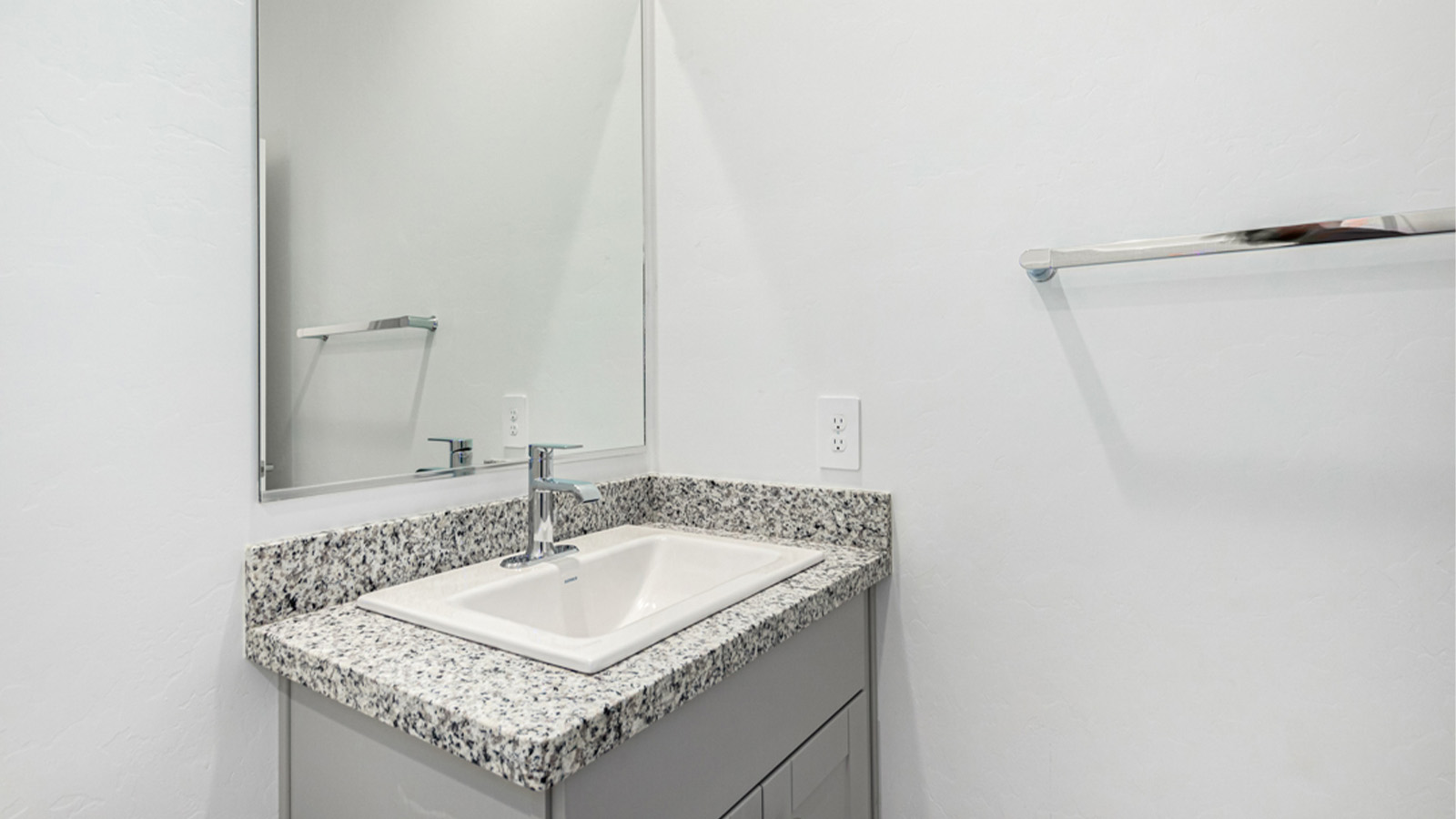 Welcome to The Amber at Hanson Ridge in Vail, Arizona – a beautifully crafted 1,331 sq. ft. single-story new home that offers modern living in a peaceful desert setting.  As you step through the inviting front porch, the thoughtfully designed entryway leads you into an open-concept living space that seamlessly connects the great room, dining area, and kitchen. This layout is ideal for both relaxing with family and entertaining guests. The kitchen, equipped with granite countertops, modern appliances, and a convenient pantry, is designed to meet your culinary needs while maintaining a stylish appeal.  The master suite, located at the rear of the home, offers a private retreat. The spacious bedroom is complemented by a large walk-in closet and an en-suite bathroom featuring dual vanities and a walk-in shower. This suite provides a serene space to unwind after a day of exploring the nearby Rincon Mountains or hiking through Saguaro National Park.  Two additional bedrooms are thoughtfully positioned to offer comfort and privacy, sharing a well-appointed full bathroom. The home also includes a utility room and direct access to a two-car garage, ensuring daily tasks are convenient and efficient.  Step outside to the covered patio, where you can enjoy Arizona’s beautiful weather and the incredible desert landscapes that Hanson Ridge has to offer. Whether you're enjoying a quiet morning coffee or hosting an evening gathering, this outdoor space is the perfect extension of your living area.  Living at Hanson Ridge means more than just having a beautiful home. The community offers a serene lifestyle with incredible mountain views and easy access to I-10 for convenient commutes to Tucson and surrounding areas. Hanson Ridge is designed with energy efficiency in mind, meeting DOE Zero Energy Ready Home standards to provide both comfort and sustainability.   Explore the charm and comfort of Hanson Ridge, where your new home awaits.