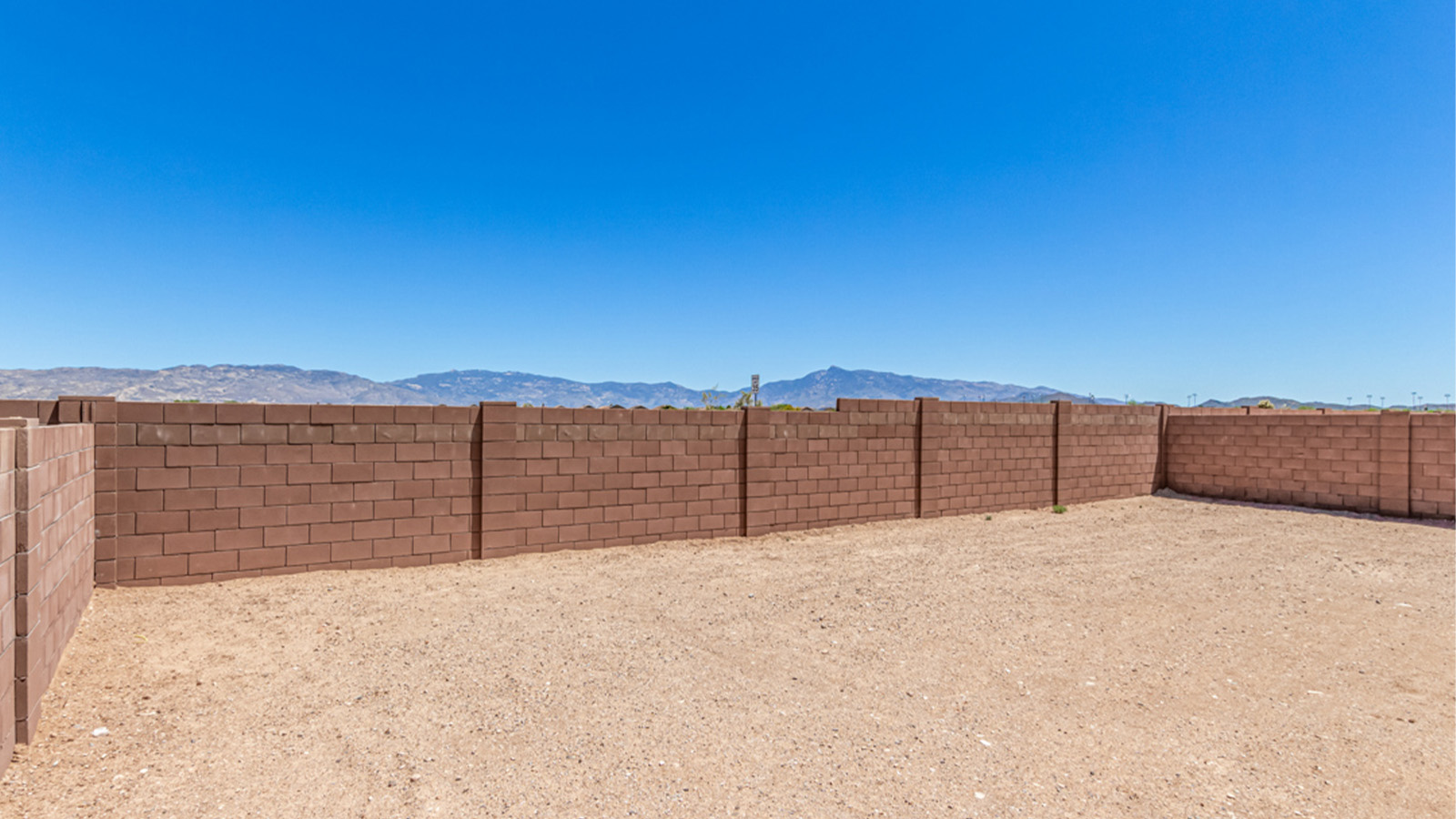 Welcome to The Amber at Hanson Ridge in Vail, Arizona – a beautifully crafted 1,331 sq. ft. single-story new home that offers modern living in a peaceful desert setting.  As you step through the inviting front porch, the thoughtfully designed entryway leads you into an open-concept living space that seamlessly connects the great room, dining area, and kitchen. This layout is ideal for both relaxing with family and entertaining guests. The kitchen, equipped with granite countertops, modern appliances, and a convenient pantry, is designed to meet your culinary needs while maintaining a stylish appeal.  The master suite, located at the rear of the home, offers a private retreat. The spacious bedroom is complemented by a large walk-in closet and an en-suite bathroom featuring dual vanities and a walk-in shower. This suite provides a serene space to unwind after a day of exploring the nearby Rincon Mountains or hiking through Saguaro National Park.  Two additional bedrooms are thoughtfully positioned to offer comfort and privacy, sharing a well-appointed full bathroom. The home also includes a utility room and direct access to a two-car garage, ensuring daily tasks are convenient and efficient.  Step outside to the covered patio, where you can enjoy Arizona’s beautiful weather and the incredible desert landscapes that Hanson Ridge has to offer. Whether you're enjoying a quiet morning coffee or hosting an evening gathering, this outdoor space is the perfect extension of your living area.  Living at Hanson Ridge means more than just having a beautiful home. The community offers a serene lifestyle with incredible mountain views and easy access to I-10 for convenient commutes to Tucson and surrounding areas. Hanson Ridge is designed with energy efficiency in mind, meeting DOE Zero Energy Ready Home standards to provide both comfort and sustainability.   Explore the charm and comfort of Hanson Ridge, where your new home awaits.