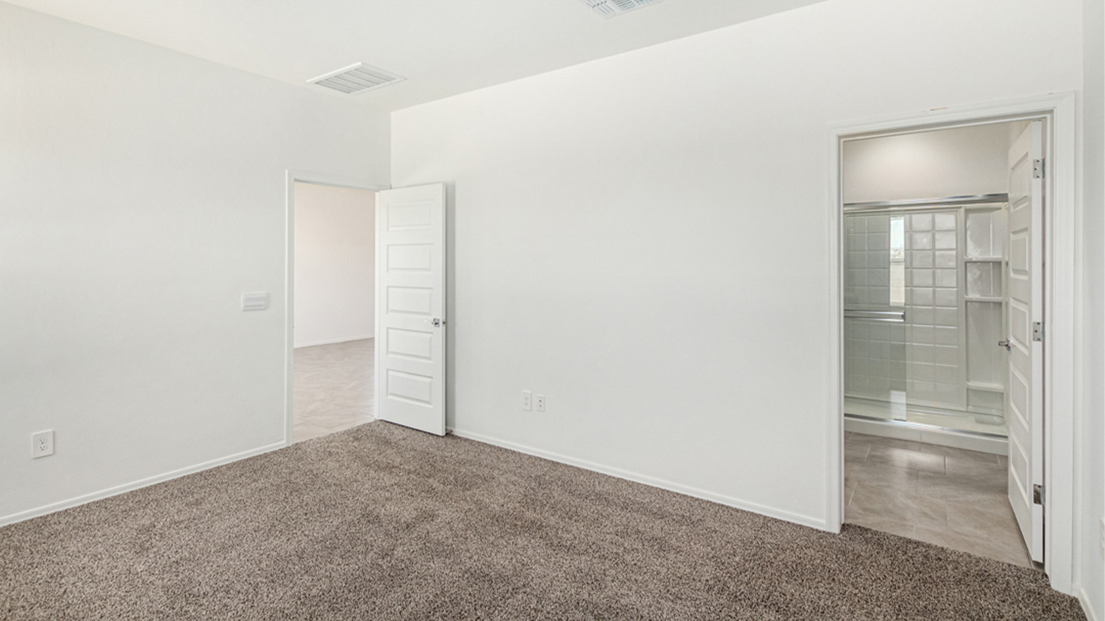 Welcome to The Amber at Hanson Ridge in Vail, Arizona – a beautifully crafted 1,331 sq. ft. single-story new home that offers modern living in a peaceful desert setting.  As you step through the inviting front porch, the thoughtfully designed entryway leads you into an open-concept living space that seamlessly connects the great room, dining area, and kitchen. This layout is ideal for both relaxing with family and entertaining guests. The kitchen, equipped with granite countertops, modern appliances, and a convenient pantry, is designed to meet your culinary needs while maintaining a stylish appeal.  The master suite, located at the rear of the home, offers a private retreat. The spacious bedroom is complemented by a large walk-in closet and an en-suite bathroom featuring dual vanities and a walk-in shower. This suite provides a serene space to unwind after a day of exploring the nearby Rincon Mountains or hiking through Saguaro National Park.  Two additional bedrooms are thoughtfully positioned to offer comfort and privacy, sharing a well-appointed full bathroom. The home also includes a utility room and direct access to a two-car garage, ensuring daily tasks are convenient and efficient.  Step outside to the covered patio, where you can enjoy Arizona’s beautiful weather and the incredible desert landscapes that Hanson Ridge has to offer. Whether you're enjoying a quiet morning coffee or hosting an evening gathering, this outdoor space is the perfect extension of your living area.  Living at Hanson Ridge means more than just having a beautiful home. The community offers a serene lifestyle with incredible mountain views and easy access to I-10 for convenient commutes to Tucson and surrounding areas. Hanson Ridge is designed with energy efficiency in mind, meeting DOE Zero Energy Ready Home standards to provide both comfort and sustainability.   Explore the charm and comfort of Hanson Ridge, where your new home awaits.