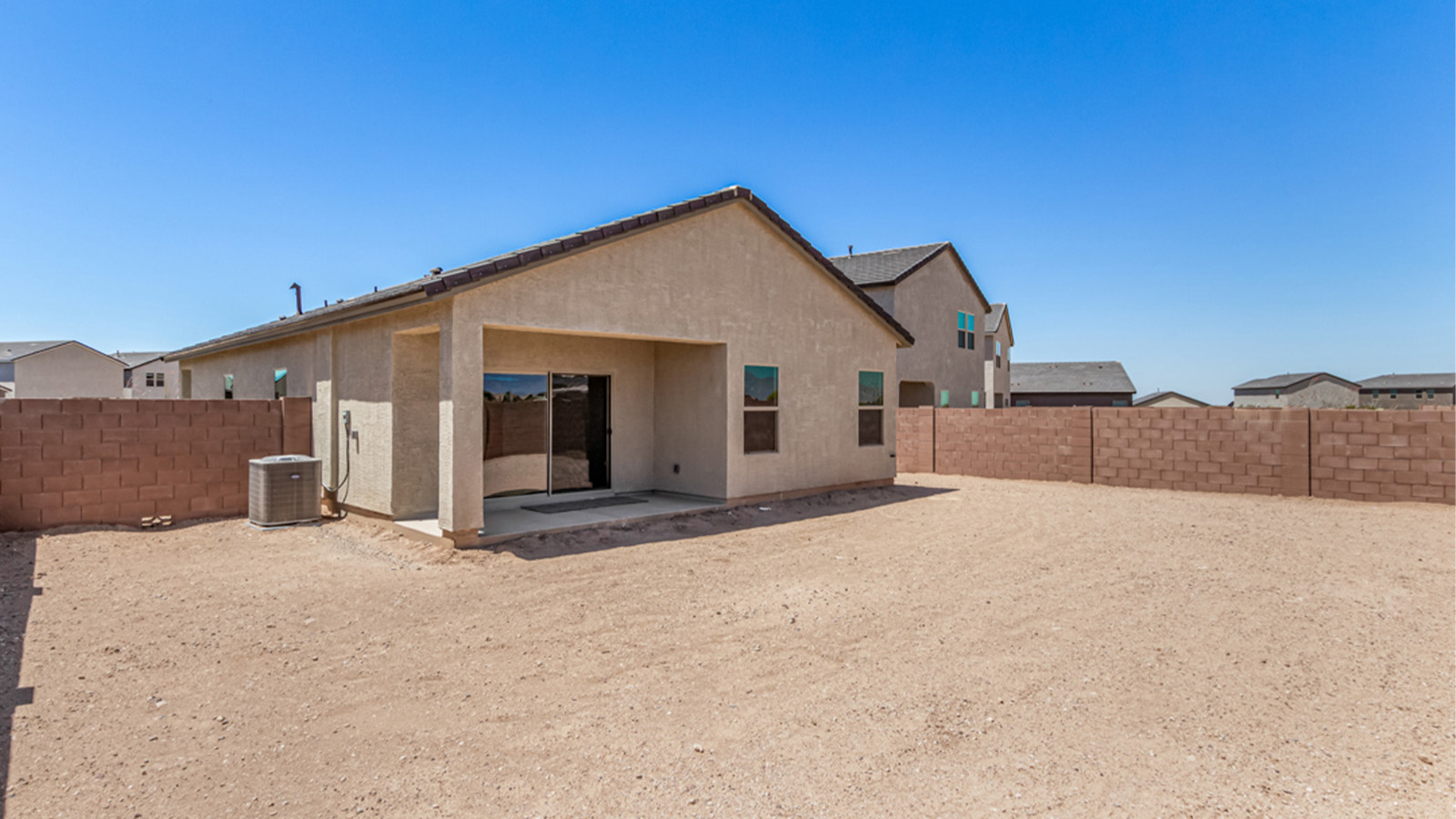 Welcome to The Amber at Hanson Ridge in Vail, Arizona – a beautifully crafted 1,331 sq. ft. single-story new home that offers modern living in a peaceful desert setting.  As you step through the inviting front porch, the thoughtfully designed entryway leads you into an open-concept living space that seamlessly connects the great room, dining area, and kitchen. This layout is ideal for both relaxing with family and entertaining guests. The kitchen, equipped with granite countertops, modern appliances, and a convenient pantry, is designed to meet your culinary needs while maintaining a stylish appeal.  The master suite, located at the rear of the home, offers a private retreat. The spacious bedroom is complemented by a large walk-in closet and an en-suite bathroom featuring dual vanities and a walk-in shower. This suite provides a serene space to unwind after a day of exploring the nearby Rincon Mountains or hiking through Saguaro National Park.  Two additional bedrooms are thoughtfully positioned to offer comfort and privacy, sharing a well-appointed full bathroom. The home also includes a utility room and direct access to a two-car garage, ensuring daily tasks are convenient and efficient.  Step outside to the covered patio, where you can enjoy Arizona’s beautiful weather and the incredible desert landscapes that Hanson Ridge has to offer. Whether you're enjoying a quiet morning coffee or hosting an evening gathering, this outdoor space is the perfect extension of your living area.  Living at Hanson Ridge means more than just having a beautiful home. The community offers a serene lifestyle with incredible mountain views and easy access to I-10 for convenient commutes to Tucson and surrounding areas. Hanson Ridge is designed with energy efficiency in mind, meeting DOE Zero Energy Ready Home standards to provide both comfort and sustainability.   Explore the charm and comfort of Hanson Ridge, where your new home awaits.