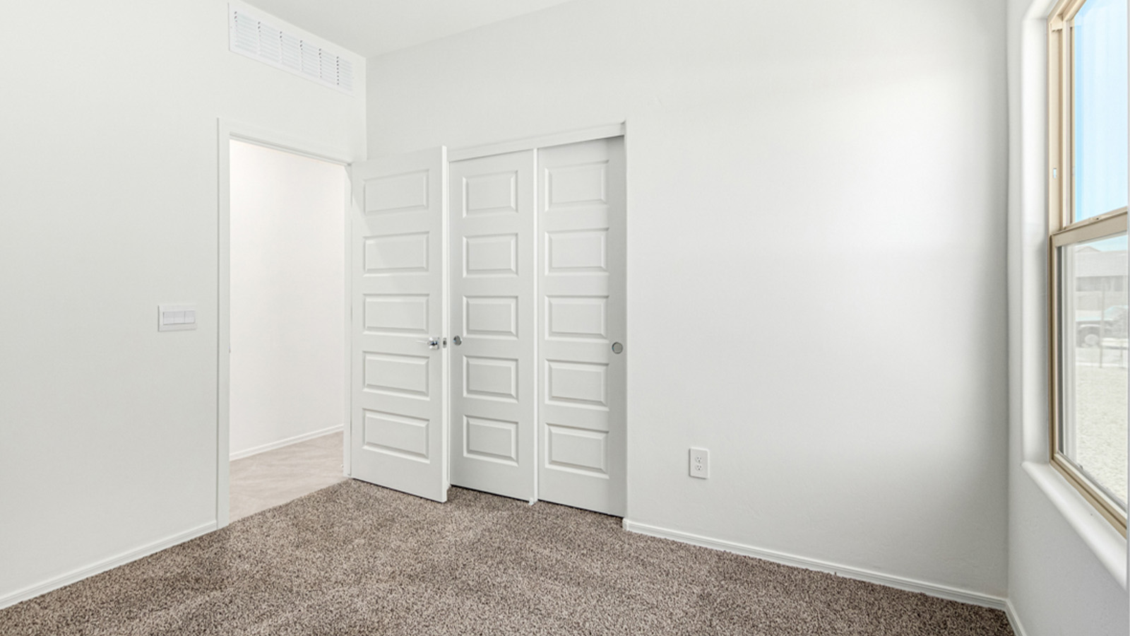 Welcome to The Amber at Hanson Ridge in Vail, Arizona – a beautifully crafted 1,331 sq. ft. single-story new home that offers modern living in a peaceful desert setting.  As you step through the inviting front porch, the thoughtfully designed entryway leads you into an open-concept living space that seamlessly connects the great room, dining area, and kitchen. This layout is ideal for both relaxing with family and entertaining guests. The kitchen, equipped with granite countertops, modern appliances, and a convenient pantry, is designed to meet your culinary needs while maintaining a stylish appeal.  The master suite, located at the rear of the home, offers a private retreat. The spacious bedroom is complemented by a large walk-in closet and an en-suite bathroom featuring dual vanities and a walk-in shower. This suite provides a serene space to unwind after a day of exploring the nearby Rincon Mountains or hiking through Saguaro National Park.  Two additional bedrooms are thoughtfully positioned to offer comfort and privacy, sharing a well-appointed full bathroom. The home also includes a utility room and direct access to a two-car garage, ensuring daily tasks are convenient and efficient.  Step outside to the covered patio, where you can enjoy Arizona’s beautiful weather and the incredible desert landscapes that Hanson Ridge has to offer. Whether you're enjoying a quiet morning coffee or hosting an evening gathering, this outdoor space is the perfect extension of your living area.  Living at Hanson Ridge means more than just having a beautiful home. The community offers a serene lifestyle with incredible mountain views and easy access to I-10 for convenient commutes to Tucson and surrounding areas. Hanson Ridge is designed with energy efficiency in mind, meeting DOE Zero Energy Ready Home standards to provide both comfort and sustainability.   Explore the charm and comfort of Hanson Ridge, where your new home awaits.