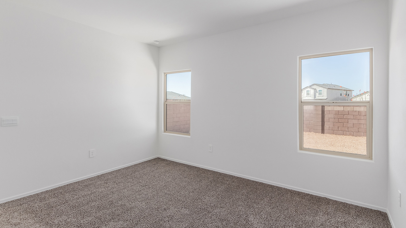 Step into The Diana at Hanson Ridge in Vail, Arizona – a thoughtfully crafted 1,558 sq. ft. single-story new home designed to offer a perfect harmony of comfort and desert elegance.  As you enter through the inviting front porch, you're welcomed into a bright and airy living space that flows seamlessly into the great room, dining area, and kitchen. This open-concept design is perfect for both casual family living and entertaining. The kitchen, with its granite countertops, modern appliances, and a convenient pantry, is both stylish and functional, making meal preparation a breeze.  The master suite, located at the rear of the home, provides a private retreat with a spacious bedroom, a large walk-in closet, and an en-suite bathroom featuring dual vanities and a walk-in shower. This suite offers a peaceful escape, ideal for relaxation after a day of enjoying the natural beauty surrounding Hanson Ridge.  Two additional bedrooms are thoughtfully placed to provide privacy and comfort, sharing a well-appointed full bathroom. The home also includes a utility room for added convenience and direct access to a two-car garage, making daily tasks efficient and easy.  Step outside from the great room to the covered patio, where you can enjoy Arizona’s beautiful weather year-round. Whether you're savoring a quiet morning or hosting an evening gathering, this outdoor space extends your living area into the tranquil surroundings of Hanson Ridge.  Living at Hanson Ridge means more than just having a beautiful home. The community offers a peaceful lifestyle with incredible desert landscapes, mountain views, and easy access to I-10 for convenient commutes to Tucson and surrounding areas. Designed with energy efficiency in mind, The Diana at Hanson Ridge meets DOE Zero Energy Ready Home standards, ensuring sustainability and long-term savings.  Experience the charm and comfort of The Diana at Hanson Ridge, where modern convenience meets the beauty of Arizona’s desert landscape.  *Images shown are for reference only. They depict the Diana model home and may not represent the actual home.