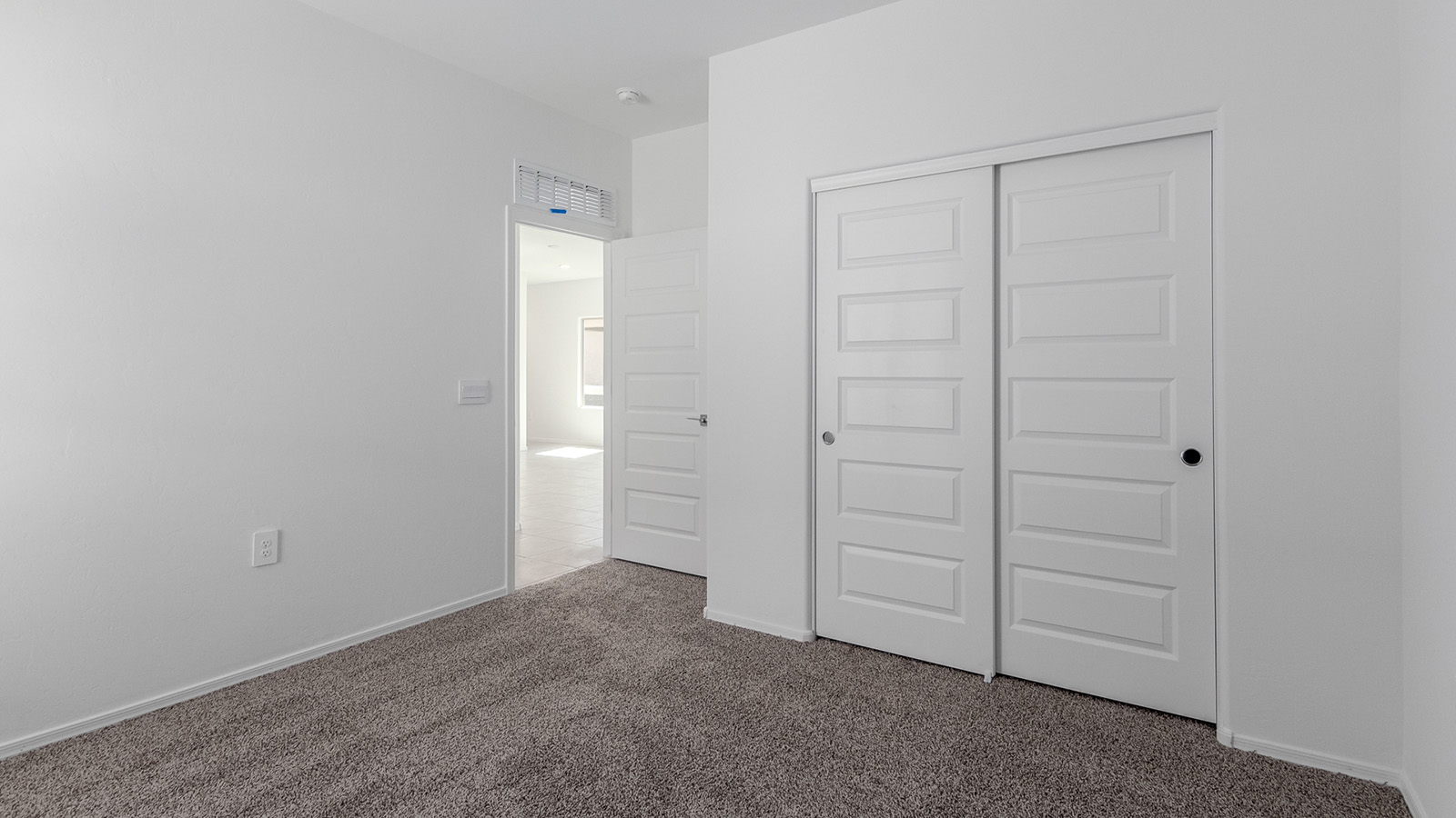 Step into The Diana at Hanson Ridge in Vail, Arizona – a thoughtfully crafted 1,558 sq. ft. single-story new home designed to offer a perfect harmony of comfort and desert elegance.  As you enter through the inviting front porch, you're welcomed into a bright and airy living space that flows seamlessly into the great room, dining area, and kitchen. This open-concept design is perfect for both casual family living and entertaining. The kitchen, with its granite countertops, modern appliances, and a convenient pantry, is both stylish and functional, making meal preparation a breeze.  The master suite, located at the rear of the home, provides a private retreat with a spacious bedroom, a large walk-in closet, and an en-suite bathroom featuring dual vanities and a walk-in shower. This suite offers a peaceful escape, ideal for relaxation after a day of enjoying the natural beauty surrounding Hanson Ridge.  Two additional bedrooms are thoughtfully placed to provide privacy and comfort, sharing a well-appointed full bathroom. The home also includes a utility room for added convenience and direct access to a two-car garage, making daily tasks efficient and easy.  Step outside from the great room to the covered patio, where you can enjoy Arizona’s beautiful weather year-round. Whether you're savoring a quiet morning or hosting an evening gathering, this outdoor space extends your living area into the tranquil surroundings of Hanson Ridge.  Living at Hanson Ridge means more than just having a beautiful home. The community offers a peaceful lifestyle with incredible desert landscapes, mountain views, and easy access to I-10 for convenient commutes to Tucson and surrounding areas. Designed with energy efficiency in mind, The Diana at Hanson Ridge meets DOE Zero Energy Ready Home standards, ensuring sustainability and long-term savings.  Experience the charm and comfort of The Diana at Hanson Ridge, where modern convenience meets the beauty of Arizona’s desert landscape.