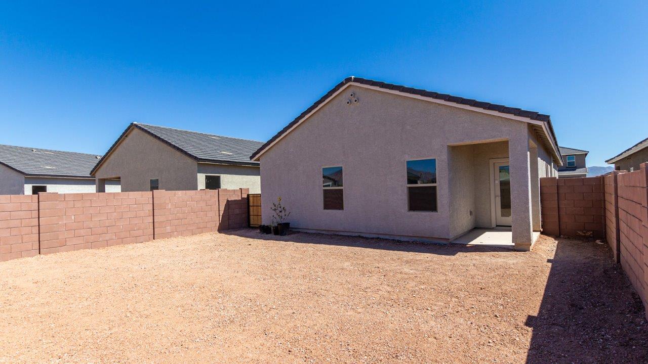Step into The Diana at Hanson Ridge in Vail, Arizona – a thoughtfully crafted 1,558 sq. ft. single-story new home designed to offer a perfect harmony of comfort and desert elegance.  As you enter through the inviting front porch, you're welcomed into a bright and airy living space that flows seamlessly into the great room, dining area, and kitchen. This open-concept design is perfect for both casual family living and entertaining. The kitchen, with its granite countertops, modern appliances, and a convenient pantry.  The primary suite, located at the rear of the home, provides a private retreat with a spacious bedroom, a large walk-in closet, and an ensuite bathroom. Two additional bedrooms are thoughtfully placed to provide privacy and comfort, sharing a well-appointed full bathroom. The home also includes a utility room for added convenience and direct access to a two-car garage, making daily tasks efficient and easy.  Step outside from the great room to the covered patio, where you can enjoy Arizona’s beautiful weather year-round. Whether you're savoring a quiet morning or hosting an evening gathering, this outdoor space extends your living area into the tranquil surroundings of Hanson Ridge.  Living at Hanson Ridge means more than just having a beautiful home. The community offers a peaceful lifestyle with incredible desert landscapes, mountain views, and easy access to I-10 for convenient commutes to Tucson and surrounding areas. Designed with energy efficiency in mind, The Diana at Hanson Ridge meets DOE Zero Energy Ready Home standards, ensuring sustainability and long-term savings.  Experience the charm and comfort of The Diana at Hanson Ridge, where modern convenience meets the beauty of Arizona’s desert landscape.  *Images shown are for reference only. They depict a virtual staged Diana model home and may not represent the actual home.