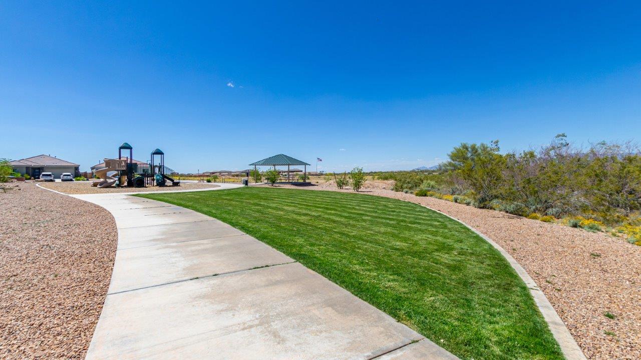 Step into The Diana at Hanson Ridge in Vail, Arizona – a thoughtfully crafted 1,558 sq. ft. single-story new home designed to offer a perfect harmony of comfort and desert elegance.  As you enter through the inviting front porch, you're welcomed into a bright and airy living space that flows seamlessly into the great room, dining area, and kitchen. This open-concept design is perfect for both casual family living and entertaining. The kitchen, with its granite countertops, modern appliances, and a convenient pantry, is both stylish and functional, making meal preparation a breeze.  The master suite, located at the rear of the home, provides a private retreat with a spacious bedroom, a large walk-in closet, and an en-suite bathroom featuring dual vanities and a walk-in shower. This suite offers a peaceful escape, ideal for relaxation after a day of enjoying the natural beauty surrounding Hanson Ridge.  Two additional bedrooms are thoughtfully placed to provide privacy and comfort, sharing a well-appointed full bathroom. The home also includes a utility room for added convenience and direct access to a two-car garage, making daily tasks efficient and easy.  Step outside from the great room to the covered patio, where you can enjoy Arizona’s beautiful weather year-round. Whether you're savoring a quiet morning or hosting an evening gathering, this outdoor space extends your living area into the tranquil surroundings of Hanson Ridge.  Living at Hanson Ridge means more than just having a beautiful home. The community offers a peaceful lifestyle with incredible desert landscapes, mountain views, and easy access to I-10 for convenient commutes to Tucson and surrounding areas. Designed with energy efficiency in mind, The Diana at Hanson Ridge meets DOE Zero Energy Ready Home standards, ensuring sustainability and long-term savings.  Experience the charm and comfort of The Diana at Hanson Ridge, where modern convenience meets the beauty of Arizona’s desert landscape.