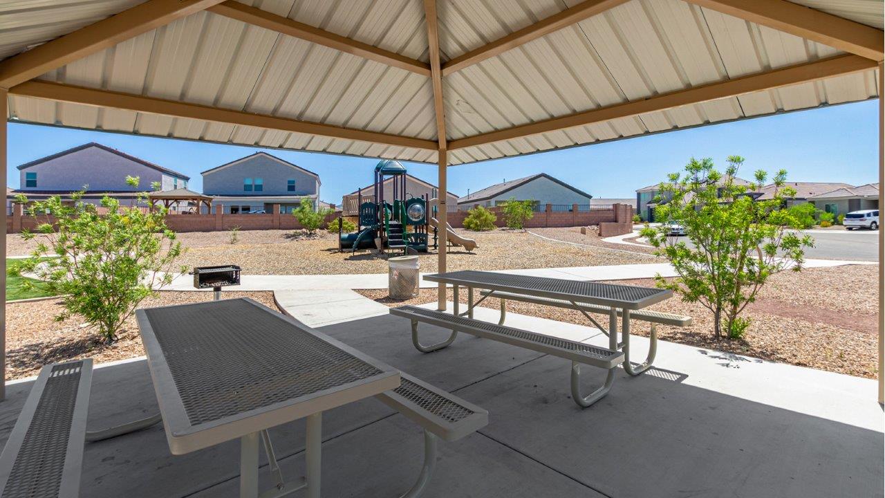 Step into The Diana at Hanson Ridge in Vail, Arizona – a thoughtfully crafted 1,558 sq. ft. single-story new home designed to offer a perfect harmony of comfort and desert elegance.  As you enter through the inviting front porch, you're welcomed into a bright and airy living space that flows seamlessly into the great room, dining area, and kitchen. This open-concept design is perfect for both casual family living and entertaining. The kitchen, with its granite countertops, modern appliances, and a convenient pantry, is both stylish and functional, making meal preparation a breeze.  The master suite, located at the rear of the home, provides a private retreat with a spacious bedroom, a large walk-in closet, and an en-suite bathroom featuring dual vanities and a walk-in shower. This suite offers a peaceful escape, ideal for relaxation after a day of enjoying the natural beauty surrounding Hanson Ridge.  Two additional bedrooms are thoughtfully placed to provide privacy and comfort, sharing a well-appointed full bathroom. The home also includes a utility room for added convenience and direct access to a two-car garage, making daily tasks efficient and easy.  Step outside from the great room to the covered patio, where you can enjoy Arizona’s beautiful weather year-round. Whether you're savoring a quiet morning or hosting an evening gathering, this outdoor space extends your living area into the tranquil surroundings of Hanson Ridge.  Living at Hanson Ridge means more than just having a beautiful home. The community offers a peaceful lifestyle with incredible desert landscapes, mountain views, and easy access to I-10 for convenient commutes to Tucson and surrounding areas. Designed with energy efficiency in mind, The Diana at Hanson Ridge meets DOE Zero Energy Ready Home standards, ensuring sustainability and long-term savings.  Experience the charm and comfort of The Diana at Hanson Ridge, where modern convenience meets the beauty of Arizona’s desert landscape.