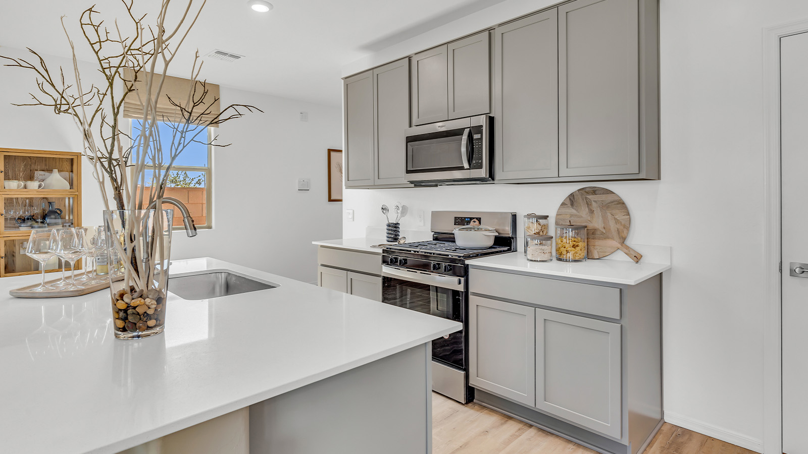 Discover The Kate at Hanson Ridge in Vail, Arizona – a beautifully designed 2,264 sq. ft. two-story floor plan that seamlessly blends functionality with style, offering a perfect retreat within the stunning desert landscape.  As you step through the front porch, you're greeted by a spacious entryway that leads directly into the heart of the home. The main floor is laid out to accommodate both everyday living and special occasions. The expansive great room opens into the dining area and the kitchen, creating a central hub for gatherings. The kitchen features quartz countertops, modern appliances, and a large walk-in pantry.  The covered patio is just off the dining area extends your living space outdoors, perfect for enjoying the beautiful Arizona weather year-round.  Upstairs, The Kate offers a private sanctuary with four well-appointed bedrooms. The primary suite is a true sanctuary, featuring a spacious bedroom, a large walk-in closet, and an en-suite bathroom. The upper level also includes three additional bedrooms, each with ample closet space, and a full bathroom conveniently located near the laundry room. A versatile loft provides additional space for relaxation, hobbies, or work, making this home ideal for growing families.  Living at Hanson Ridge means enjoying the best of both worlds – a peaceful, scenic environment with easy access to modern conveniences. The community offers parks, walking paths, and playgrounds, making it a perfect setting for families. Hanson Ridge homes, including The Kate, are built with energy efficiency in mind, meeting DOE Zero Energy Ready Home standards. This means you can enjoy a sustainable lifestyle with lower utility costs, featuring advanced energy-saving technologies and smart home features.  *Images shown are for reference only. They depict the Kate model and may not represent the actual home.