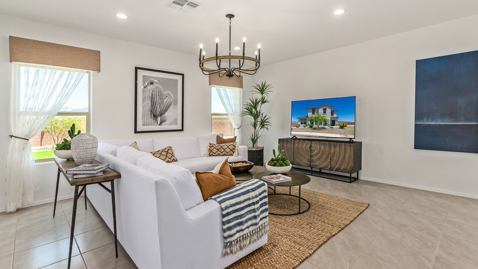 Discover The Kate at Hanson Ridge in Vail, Arizona – a beautifully designed 2,264 sq. ft. two-story floor plan that seamlessly blends functionality with style, offering a perfect retreat within the stunning desert landscape.  As you step through the front porch, you're greeted by a spacious entryway that leads directly into the heart of the home. The main floor is laid out to accommodate both everyday living and special occasions. The expansive great room opens into the dining area and the kitchen, creating a central hub for gatherings. The kitchen features quartz countertops, modern appliances, and a large walk-in pantry.  The covered patio is just off the dining area extends your living space outdoors, perfect for enjoying the beautiful Arizona weather year-round.  Upstairs, The Kate offers a private sanctuary with four well-appointed bedrooms. The primary suite is a true sanctuary, featuring a spacious bedroom, a large walk-in closet, and an en-suite bathroom. The upper level also includes three additional bedrooms, each with ample closet space, and a full bathroom conveniently located near the laundry room. A versatile loft provides additional space for relaxation, hobbies, or work, making this home ideal for growing families.  Living at Hanson Ridge means enjoying the best of both worlds – a peaceful, scenic environment with easy access to modern conveniences. The community offers parks, walking paths, and playgrounds, making it a perfect setting for families. Hanson Ridge homes, including The Kate, are built with energy efficiency in mind, meeting DOE Zero Energy Ready Home standards. This means you can enjoy a sustainable lifestyle with lower utility costs, featuring advanced energy-saving technologies and smart home features.  *Images shown are for reference only. They depict The Kate model and may not represent the actual home.