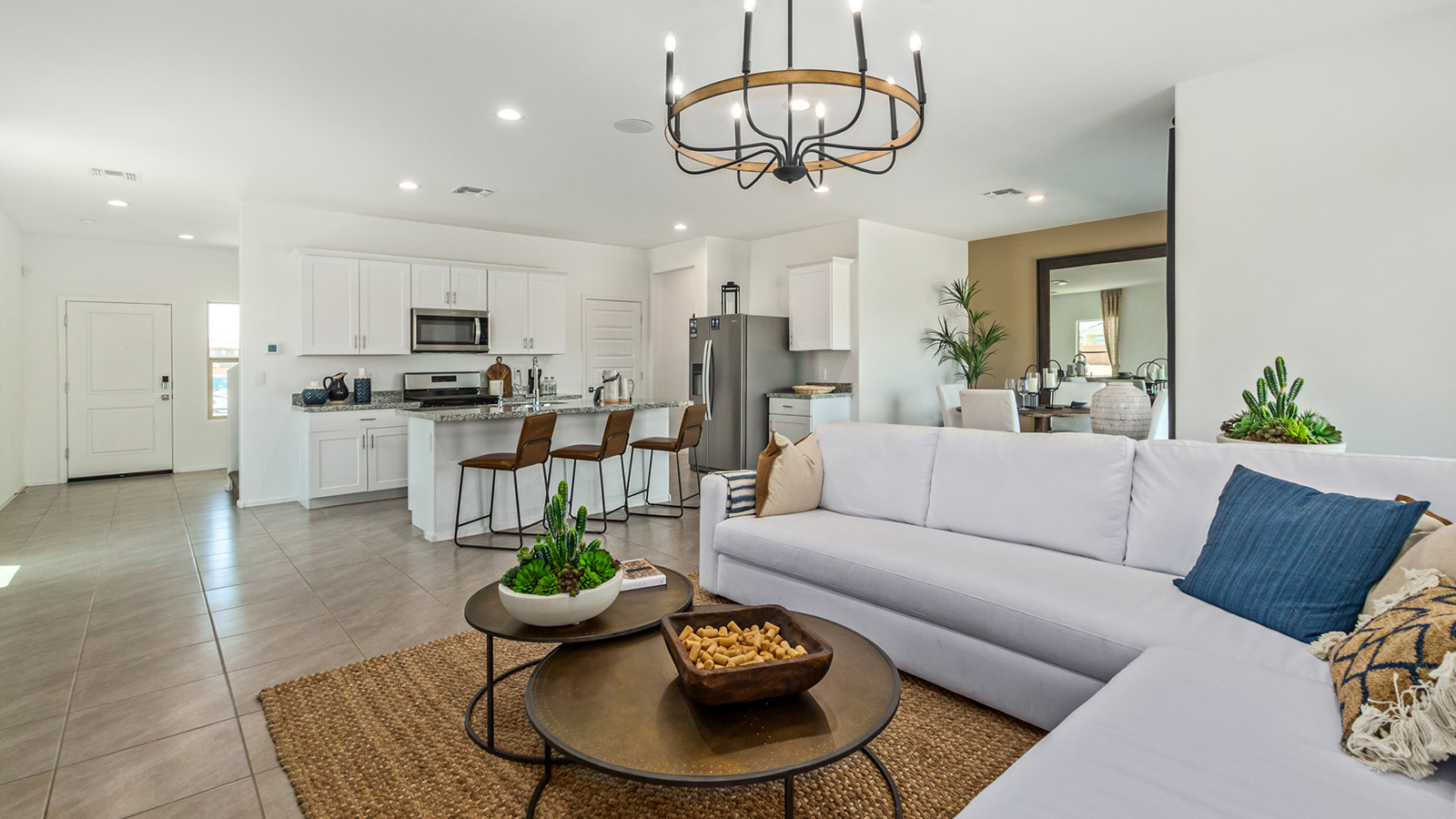 Discover The Kate at Hanson Ridge in Vail, Arizona – a beautifully designed 2,264 sq. ft. two-story floor plan that seamlessly blends functionality with style, offering a perfect retreat within the stunning desert landscape.  As you step through the front porch, you're greeted by a spacious entryway that leads directly into the heart of the home. The main floor is laid out to accommodate both everyday living and special occasions. The expansive great room opens into the dining area and the kitchen, creating a central hub for gatherings. The kitchen features quartz countertops, modern appliances, and a large walk-in pantry.  The covered patio is just off the dining area extends your living space outdoors, perfect for enjoying the beautiful Arizona weather year-round.  Upstairs, The Kate offers a private sanctuary with four well-appointed bedrooms. The primary suite is a true sanctuary, featuring a spacious bedroom, a large walk-in closet, and an en-suite bathroom. The upper level also includes three additional bedrooms, each with ample closet space, and a full bathroom conveniently located near the laundry room. A versatile loft provides additional space for relaxation, hobbies, or work, making this home ideal for growing families.  Living at Hanson Ridge means enjoying the best of both worlds – a peaceful, scenic environment with easy access to modern conveniences. The community offers parks, walking paths, and playgrounds, making it a perfect setting for families. Hanson Ridge homes, including The Kate, are built with energy efficiency in mind, meeting DOE Zero Energy Ready Home standards. This means you can enjoy a sustainable lifestyle with lower utility costs, featuring advanced energy-saving technologies and smart home features.  *Images shown are for reference only. They depict The Kate model and may not represent the actual home.