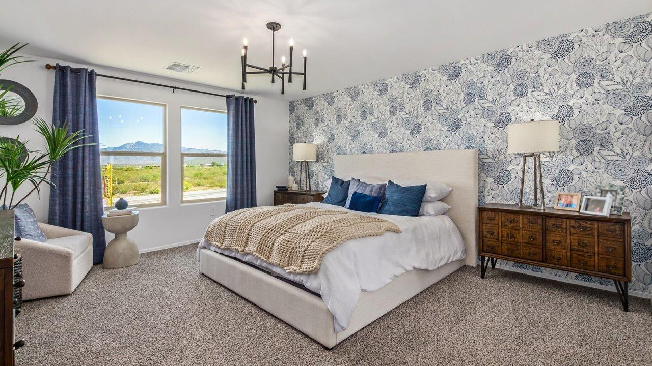 Discover The Kate at Hanson Ridge in Vail, Arizona – a beautifully designed 2,264 sq. ft. two-story floor plan that seamlessly blends functionality with style, offering a perfect retreat within the stunning desert landscape.  As you step through the front porch, you're greeted by a spacious entryway that leads directly into the heart of the home. The main floor is laid out to accommodate both everyday living and special occasions. The expansive great room opens into the dining area and the kitchen, creating a central hub for gatherings. The kitchen features quartz countertops, modern appliances, and a large walk-in pantry.  The covered patio is just off the dining area extends your living space outdoors, perfect for enjoying the beautiful Arizona weather year-round.  Upstairs, The Kate offers a private sanctuary with four well-appointed bedrooms. The primary suite is a true sanctuary, featuring a spacious bedroom, a large walk-in closet, and an en-suite bathroom. The upper level also includes three additional bedrooms, each with ample closet space, and a full bathroom conveniently located near the laundry room. A versatile loft provides additional space for relaxation, hobbies, or work, making this home ideal for growing families.  Living at Hanson Ridge means enjoying the best of both worlds – a peaceful, scenic environment with easy access to modern conveniences. The community offers parks, walking paths, and playgrounds, making it a perfect setting for families. Hanson Ridge homes, including The Kate, are built with energy efficiency in mind, meeting DOE Zero Energy Ready Home standards. This means you can enjoy a sustainable lifestyle with lower utility costs, featuring advanced energy-saving technologies and smart home features.  *Images shown are for reference only. They depict The Kate model and may not represent the actual home.