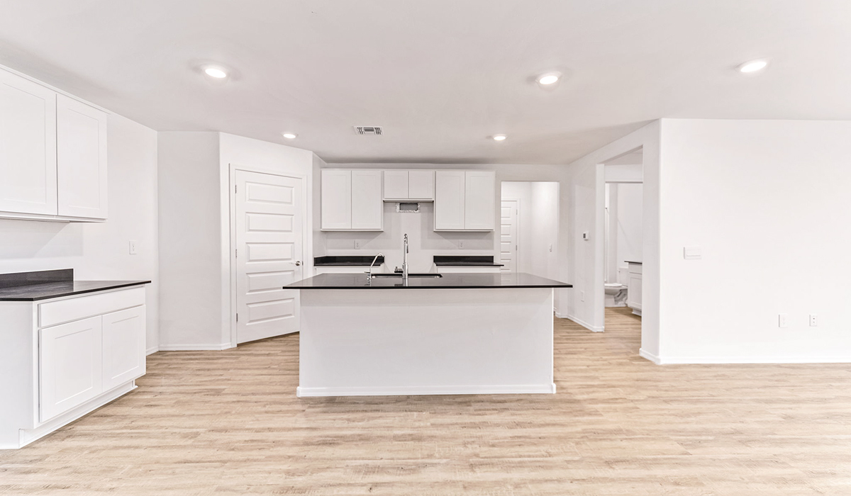 Welcome to The Madison at Hanson Ridge in Vail, Arizona – a beautifully designed 2,522 sq. ft. two-story floor plan designed for families seeking both luxury and functionality.  As you step through the inviting front porch, you're greeted by a thoughtfully designed entryway that leads into the heart of the home. The main level features a spacious great room that flows effortlessly into the dining area and the kitchen, making it an ideal space for entertaining and family gatherings. The kitchen is equipped with elegant quartz countertops, a large central island with a breakfast bar, modern appliances, and a pantry that provides ample storage, ensuring that the kitchen is as functional as it is stylish.  The main floor also includes a bedroom with easy access to a full bathroom, making it a perfect guest suite or a private home office. The convenient bathroom and direct access to the two-car garage enhance the home’s functionality, while the nearby utility room adds a layer of practicality to daily living.  Heading upstairs, you’ll find the family’s private quarters. The primary suite is a true retreat, featuring a generously sized bedroom, a large walk-in closet, and an en-suite bathroom. The upper level also includes three additional bedrooms, a full bathroom, and a versatile loft area that can be tailored to fit your lifestyle, whether as a playroom, home office, or additional living space.  Back downstairs, step outside from the great room to the covered patio, where you can enjoy Tucson’s stunning weather year-round. Whether you’re hosting an outdoor gathering or simply relaxing after a long day, this space extends your living area and enhances the home’s inviting ambiance.  Designed with energy efficiency in mind, The Madison at Hanson Ridge is a DOE Zero Energy Ready Home, ensuring sustainability, comfort, and long-term savings.