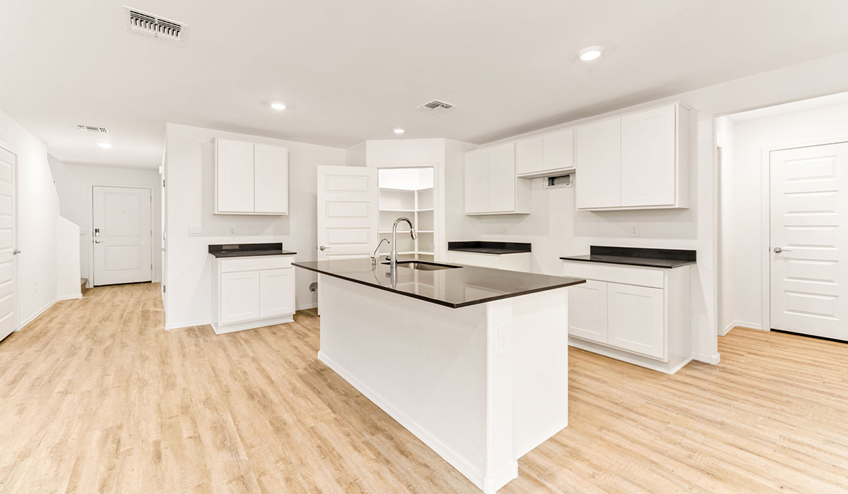 Welcome to The Madison at Hanson Ridge in Vail, Arizona – a beautifully designed 2,522 sq. ft. two-story floor plan designed for families seeking both luxury and functionality.  As you step through the inviting front porch, you're greeted by a thoughtfully designed entryway that leads into the heart of the home. The main level features a spacious great room that flows effortlessly into the dining area and the kitchen, making it an ideal space for entertaining and family gatherings. The kitchen is equipped with elegant quartz countertops, a large central island with a breakfast bar, modern appliances, and a pantry that provides ample storage, ensuring that the kitchen is as functional as it is stylish.  The main floor also includes a bedroom with easy access to a full bathroom, making it a perfect guest suite or a private home office. The convenient bathroom and direct access to the two-car garage enhance the home’s functionality, while the nearby utility room adds a layer of practicality to daily living.  Heading upstairs, you’ll find the family’s private quarters. The primary suite is a true retreat, featuring a generously sized bedroom, a large walk-in closet, and an en-suite bathroom. The upper level also includes three additional bedrooms, a full bathroom, and a versatile loft area that can be tailored to fit your lifestyle, whether as a playroom, home office, or additional living space.  Back downstairs, step outside from the great room to the covered patio, where you can enjoy Tucson’s stunning weather year-round. Whether you’re hosting an outdoor gathering or simply relaxing after a long day, this space extends your living area and enhances the home’s inviting ambiance.  Designed with energy efficiency in mind, The Madison at Hanson Ridge is a DOE Zero Energy Ready Home, ensuring sustainability, comfort, and long-term savings.