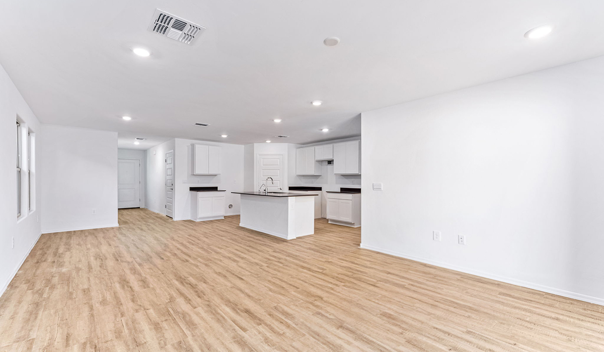 Welcome to The Madison at Hanson Ridge in Vail, Arizona – a beautifully designed 2,522 sq. ft. two-story floor plan designed for families seeking both luxury and functionality.  As you step through the inviting front porch, you're greeted by a thoughtfully designed entryway that leads into the heart of the home. The main level features a spacious great room that flows effortlessly into the dining area and the kitchen, making it an ideal space for entertaining and family gatherings. The kitchen is equipped with elegant quartz countertops, a large central island with a breakfast bar, modern appliances, and a pantry that provides ample storage, ensuring that the kitchen is as functional as it is stylish.  The main floor also includes a bedroom with easy access to a full bathroom, making it a perfect guest suite or a private home office. The convenient bathroom and direct access to the two-car garage enhance the home’s functionality, while the nearby utility room adds a layer of practicality to daily living.  Heading upstairs, you’ll find the family’s private quarters. The primary suite is a true retreat, featuring a generously sized bedroom, a large walk-in closet, and an en-suite bathroom. The upper level also includes three additional bedrooms, a full bathroom, and a versatile loft area that can be tailored to fit your lifestyle, whether as a playroom, home office, or additional living space.  Back downstairs, step outside from the great room to the covered patio, where you can enjoy Tucson’s stunning weather year-round. Whether you’re hosting an outdoor gathering or simply relaxing after a long day, this space extends your living area and enhances the home’s inviting ambiance.  Designed with energy efficiency in mind, The Madison at Hanson Ridge is a DOE Zero Energy Ready Home, ensuring sustainability, comfort, and long-term savings.