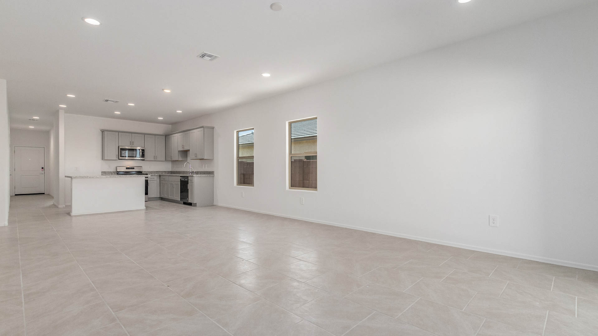 Discover the Parker at Hanson Ridge in Vail, Arizona - a beautifully designed single-story home that perfectly balances comfort and elegance. This thoughtfully crafted 1,909 square foot floor plan features five bedrooms and 3 full size bathrooms. Whether you're looking for extra space or a more open layout, the Parker is designed to suit your lifestyle with style and functionality in every detail.  As you enter through the inviting front porch, you're welcomed into a bright and airy living space that flows seamlessly into the great room, dining area, and kitchen. This open-concept design is perfect for both family gatherings and entertaining. The kitchen features Quartz countertops, Shaker Style Cabinetry, modern appliances, and a convenient pantry, making meal preparation a breeze.  The primary suite, located at the rear of the home, providing a private retreat with a spacious a large walk-in closet, and en-suite bathroom featuring dual vanities and a walk-in shower. The Parker floor plan also includes a utility room and two-car garage.  Living at Hanson Ridge means more than just having a beautiful home. The community offers a peaceful lifestyle with incredible desert landscapes, mountain views, and easy access to I-10 for convenient commutes to Tucson and surrounding areas. Designed with energy efficiency in mind, The Dalea at Hanson Ridge meets Zero Energy Ready Home standards, ensuring sustainability and long-term savings.  Experience the charm and comfort of The Parker at Hanson Ridge, where modern convenience meets the beauty of Arizona’s desert landscape.