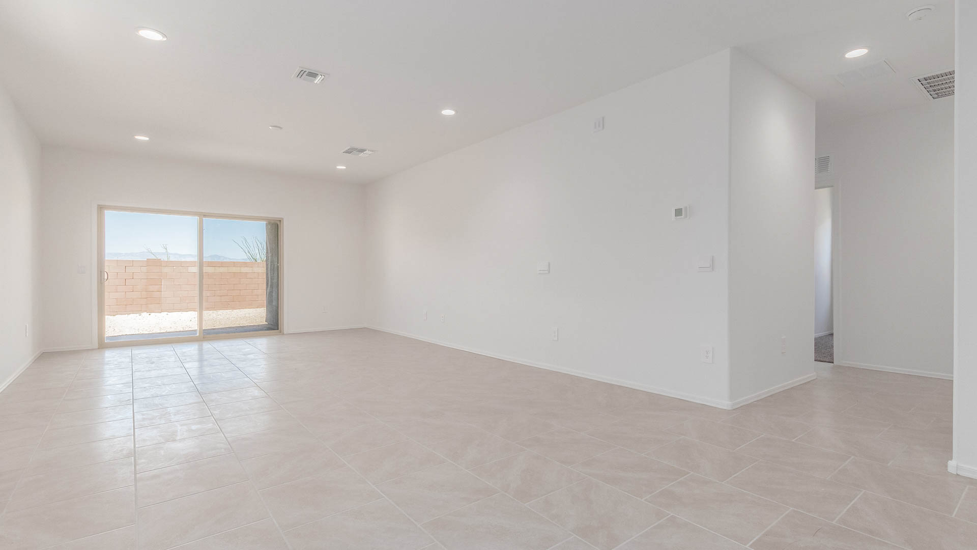 Discover the Parker at Hanson Ridge in Vail, Arizona - a beautifully designed single-story home that perfectly balances comfort and elegance. This thoughtfully crafted 1,909 square foot floor plan features five bedrooms and 3 full size bathrooms. Whether you're looking for extra space or a more open layout, the Parker is designed to suit your lifestyle with style and functionality in every detail.  As you enter through the inviting front porch, you're welcomed into a bright and airy living space that flows seamlessly into the great room, dining area, and kitchen. This open-concept design is perfect for both family gatherings and entertaining. The kitchen features Quartz countertops, Shaker Style Cabinetry, modern appliances, and a convenient pantry, making meal preparation a breeze.  The primary suite, located at the rear of the home, providing a private retreat with a spacious a large walk-in closet, and en-suite bathroom featuring dual vanities and a walk-in shower. The Parker floor plan also includes a utility room and two-car garage.  Living at Hanson Ridge means more than just having a beautiful home. The community offers a peaceful lifestyle with incredible desert landscapes, mountain views, and easy access to I-10 for convenient commutes to Tucson and surrounding areas. Designed with energy efficiency in mind, The Dalea at Hanson Ridge meets Zero Energy Ready Home standards, ensuring sustainability and long-term savings.  Experience the charm and comfort of The Parker at Hanson Ridge, where modern convenience meets the beauty of Arizona’s desert landscape.