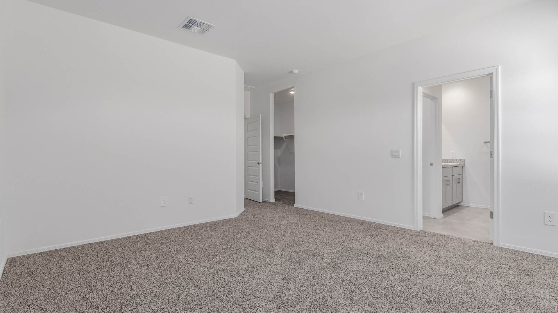 Discover the Parker at Hanson Ridge in Vail, Arizona - a beautifully designed single-story home that perfectly balances comfort and elegance. This thoughtfully crafted 1,909 square foot floor plan features five bedrooms and 3 full size bathrooms. Whether you're looking for extra space or a more open layout, the Parker is designed to suit your lifestyle with style and functionality in every detail.  As you enter through the inviting front porch, you're welcomed into a bright and airy living space that flows seamlessly into the great room, dining area, and kitchen. This open-concept design is perfect for both family gatherings and entertaining. The kitchen features Quartz countertops, Shaker Style Cabinetry, modern appliances, and a convenient pantry, making meal preparation a breeze.  The primary suite, located at the rear of the home, providing a private retreat with a spacious a large walk-in closet, and en-suite bathroom featuring dual vanities and a walk-in shower. The Parker floor plan also includes a utility room and two-car garage.  Living at Hanson Ridge means more than just having a beautiful home. The community offers a peaceful lifestyle with incredible desert landscapes, mountain views, and easy access to I-10 for convenient commutes to Tucson and surrounding areas. Designed with energy efficiency in mind, The Dalea at Hanson Ridge meets Zero Energy Ready Home standards, ensuring sustainability and long-term savings.  Experience the charm and comfort of The Parker at Hanson Ridge, where modern convenience meets the beauty of Arizona’s desert landscape.