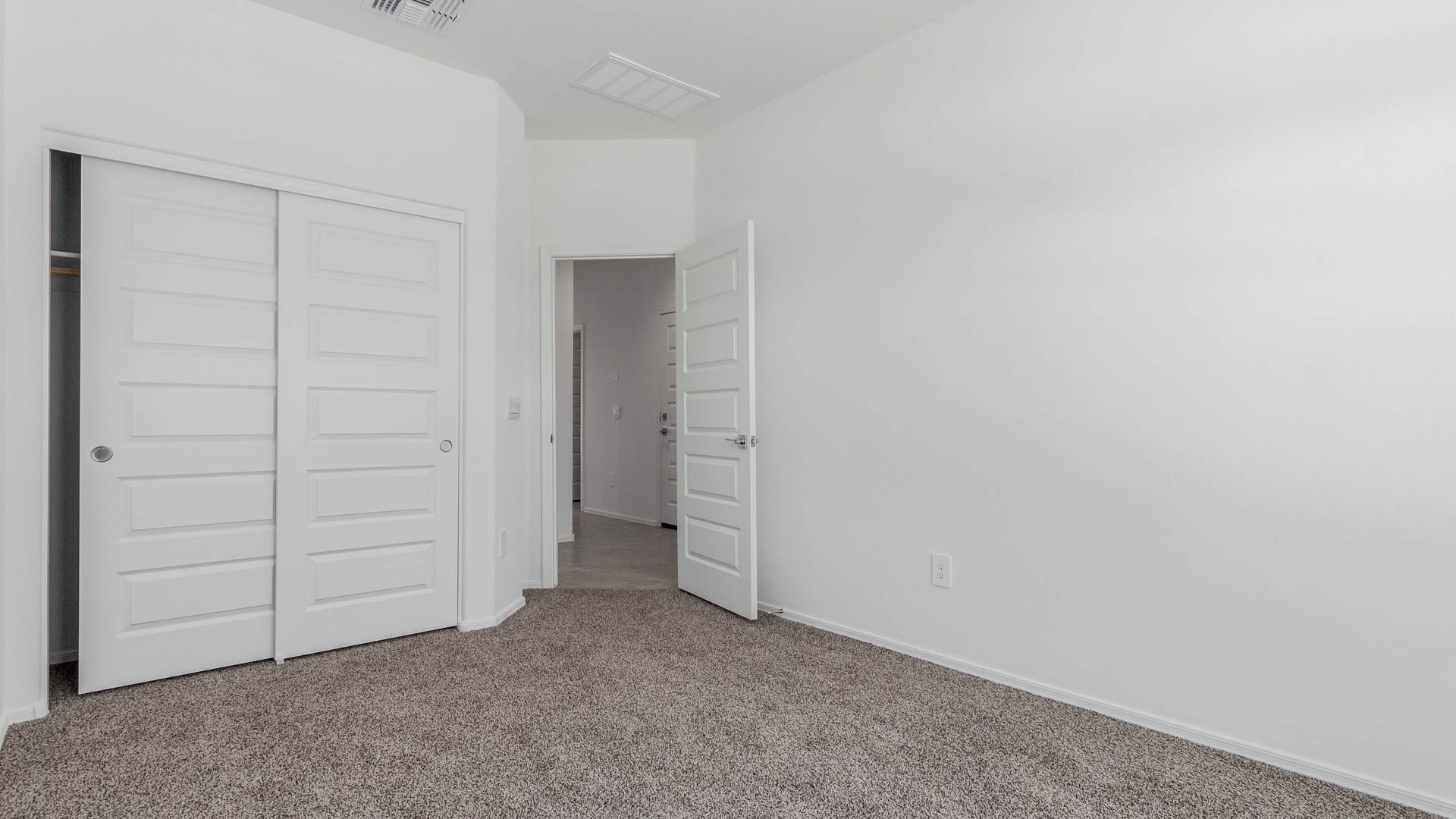 Discover the Parker at Hanson Ridge in Vail, Arizona - a beautifully designed single-story home that perfectly balances comfort and elegance. This thoughtfully crafted 1,909 square foot floor plan features five bedrooms and 3 full size bathrooms. Whether you're looking for extra space or a more open layout, the Parker is designed to suit your lifestyle with style and functionality in every detail.  As you enter through the inviting front porch, you're welcomed into a bright and airy living space that flows seamlessly into the great room, dining area, and kitchen. This open-concept design is perfect for both family gatherings and entertaining. The kitchen features Quartz countertops, Shaker Style Cabinetry, modern appliances, and a convenient pantry, making meal preparation a breeze.  The primary suite, located at the rear of the home, providing a private retreat with a spacious a large walk-in closet, and en-suite bathroom featuring dual vanities and a walk-in shower. The Parker floor plan also includes a utility room and two-car garage.  Living at Hanson Ridge means more than just having a beautiful home. The community offers a peaceful lifestyle with incredible desert landscapes, mountain views, and easy access to I-10 for convenient commutes to Tucson and surrounding areas. Designed with energy efficiency in mind, The Dalea at Hanson Ridge meets Zero Energy Ready Home standards, ensuring sustainability and long-term savings.  Experience the charm and comfort of The Parker at Hanson Ridge, where modern convenience meets the beauty of Arizona’s desert landscape.