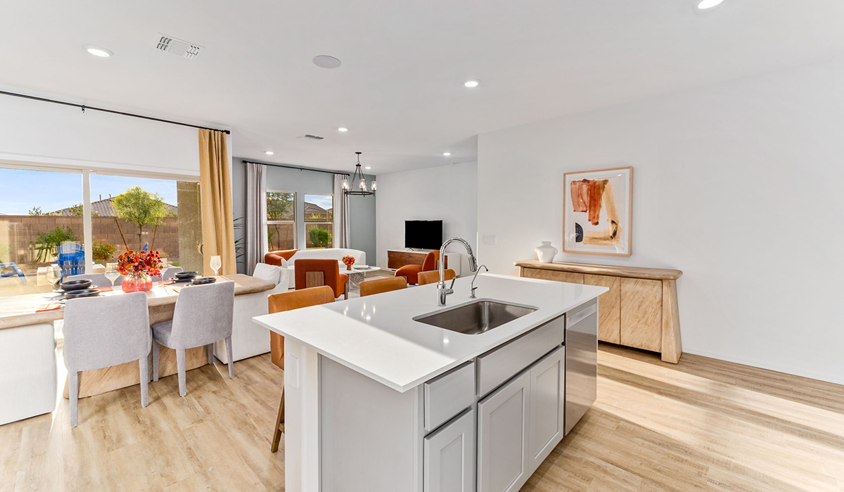 Step into The Cali at Hanson Ridge in Vail, Arizona - a thoughtfully crafted 1,823 sq. ft. single-story new home designed to offer a perfect harmony of comfort and desert elegance. As you enter through the inviting front porch, you're welcomed into a bright and airy living space that flows seamlessly into the great room, dining area, and kitchen. This open-concept design is perfect for both casual family living and entertaining. The kitchen, with its Quartz countertops, modern appliances, and a convenient pantry, is both stylish and functional, making meal preparation a breeze. The primary suite, located at the rear of the home, provides a private retreat with a spacious bedroom, a large walk-in closet, and an en-suite bathroom featuring dual vanities and a walk-in shower.  Whether you’re planning to create a dream outdoor oasis or simply enjoy the natural surroundings, this space offers endless possibilities. Built with modern living in mind, The Cali includes D.R. Horton’s Home is Connected® Smart Home package, featuring a smart thermostat, video doorbell, keyless entry, and a Wi-Fi enabled garage door opener. Energy efficiency is also a priority, with spray foam insulation and designs that meet the DOE Zero Energy Ready Home standards, ensuring long-term savings and environmental benefits.  Located within the serene Hanson Ridge community, residents of The Cali enjoy the luxury of space combined with easy access to urban amenities. Come home to The Cali, where comfort, style, and the beauty of Arizona living come together in perfect harmony.  *Images shown are for reference only. They depict the sales model home and may not represent the actual home.