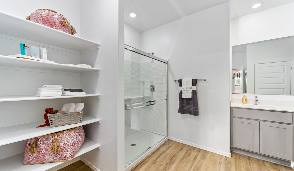 Step into The Cali at Hanson Ridge in Vail, Arizona - a thoughtfully crafted 1,823 sq. ft. single-story new home designed to offer a perfect harmony of comfort and desert elegance. As you enter through the inviting front porch, you're welcomed into a bright and airy living space that flows seamlessly into the great room, dining area, and kitchen. This open-concept design is perfect for both casual family living and entertaining. The kitchen, with its Quartz countertops, modern appliances, and a convenient pantry, is both stylish and functional, making meal preparation a breeze. The primary suite, located at the rear of the home, provides a private retreat with a spacious bedroom, a large walk-in closet, and an en-suite bathroom featuring dual vanities and a walk-in shower.  Whether you’re planning to create a dream outdoor oasis or simply enjoy the natural surroundings, this space offers endless possibilities. Built with modern living in mind, The Cali includes D.R. Horton’s Home is Connected® Smart Home package, featuring a smart thermostat, video doorbell, keyless entry, and a Wi-Fi enabled garage door opener. Energy efficiency is also a priority, with spray foam insulation and designs that meet the DOE Zero Energy Ready Home standards, ensuring long-term savings and environmental benefits.  Located within the serene Hanson Ridge community, residents of The Cali enjoy the luxury of space combined with easy access to urban amenities. Come home to The Cali, where comfort, style, and the beauty of Arizona living come together in perfect harmony.  *Images shown are for reference only. They depict the sales model home and may not represent the actual home.