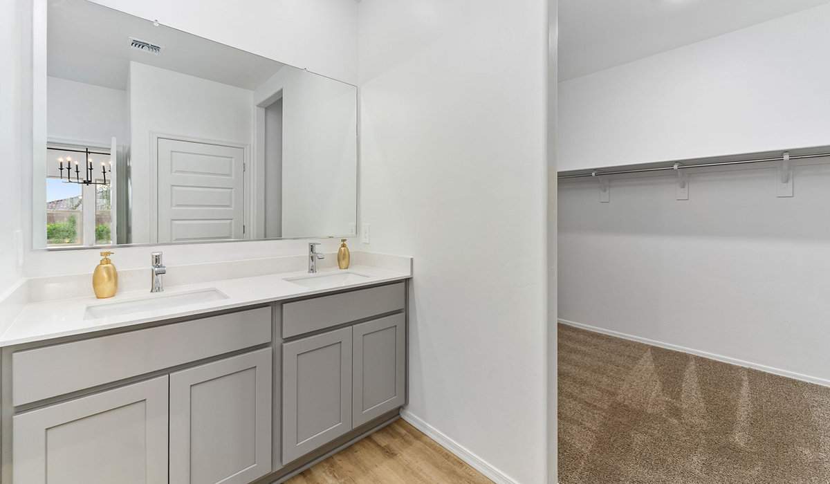 Step into The Cali at Hanson Ridge in Vail, Arizona - a thoughtfully crafted 1,823 sq. ft. single-story new home designed to offer a perfect harmony of comfort and desert elegance. As you enter through the inviting front porch, you're welcomed into a bright and airy living space that flows seamlessly into the great room, dining area, and kitchen. This open-concept design is perfect for both casual family living and entertaining. The kitchen, with its Quartz countertops, modern appliances, and a convenient pantry, is both stylish and functional, making meal preparation a breeze. The primary suite, located at the rear of the home, provides a private retreat with a spacious bedroom, a large walk-in closet, and an en-suite bathroom featuring dual vanities and a walk-in shower.  Whether you’re planning to create a dream outdoor oasis or simply enjoy the natural surroundings, this space offers endless possibilities. Built with modern living in mind, The Cali includes D.R. Horton’s Home is Connected® Smart Home package, featuring a smart thermostat, video doorbell, keyless entry, and a Wi-Fi enabled garage door opener. Energy efficiency is also a priority, with spray foam insulation and designs that meet the DOE Zero Energy Ready Home standards, ensuring long-term savings and environmental benefits.  Located within the serene Hanson Ridge community, residents of The Cali enjoy the luxury of space combined with easy access to urban amenities. Come home to The Cali, where comfort, style, and the beauty of Arizona living come together in perfect harmony.  *Images shown are for reference only. They depict the sales model home and may not represent the actual home.