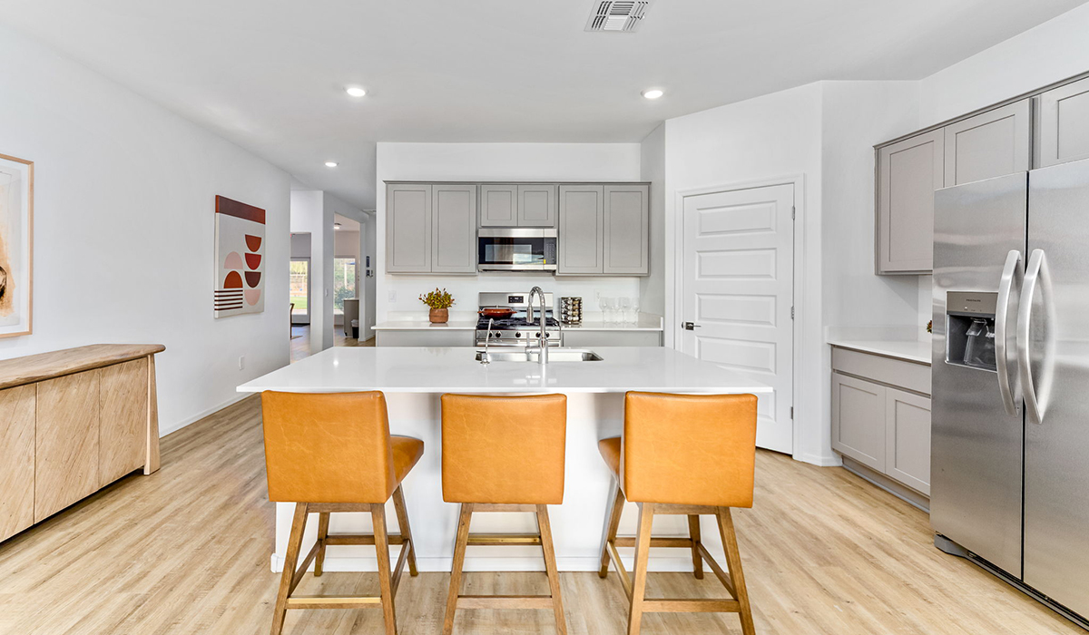 Step into The Cali at Hanson Ridge in Vail, Arizona - a thoughtfully crafted 1,823 sq. ft. single-story new home designed to offer a perfect harmony of comfort and desert elegance. As you enter through the inviting front porch, you're welcomed into a bright and airy living space that flows seamlessly into the great room, dining area, and kitchen. This open-concept design is perfect for both casual family living and entertaining. The kitchen, with its Quartz countertops, modern appliances, and a convenient pantry, is both stylish and functional, making meal preparation a breeze. The primary suite, located at the rear of the home, provides a private retreat with a spacious bedroom, a large walk-in closet, and an en-suite bathroom featuring dual vanities and a walk-in shower.  Whether you’re planning to create a dream outdoor oasis or simply enjoy the natural surroundings, this space offers endless possibilities. Built with modern living in mind, The Cali includes D.R. Horton’s Home is Connected® Smart Home package, featuring a smart thermostat, video doorbell, keyless entry, and a Wi-Fi enabled garage door opener. Energy efficiency is also a priority, with spray foam insulation and designs that meet the DOE Zero Energy Ready Home standards, ensuring long-term savings and environmental benefits.  Located within the serene Hanson Ridge community, residents of The Cali enjoy the luxury of space combined with easy access to urban amenities. Come home to The Cali, where comfort, style, and the beauty of Arizona living come together in perfect harmony.  *Images shown are for reference only. They depict the sales model home and may not represent the actual home.