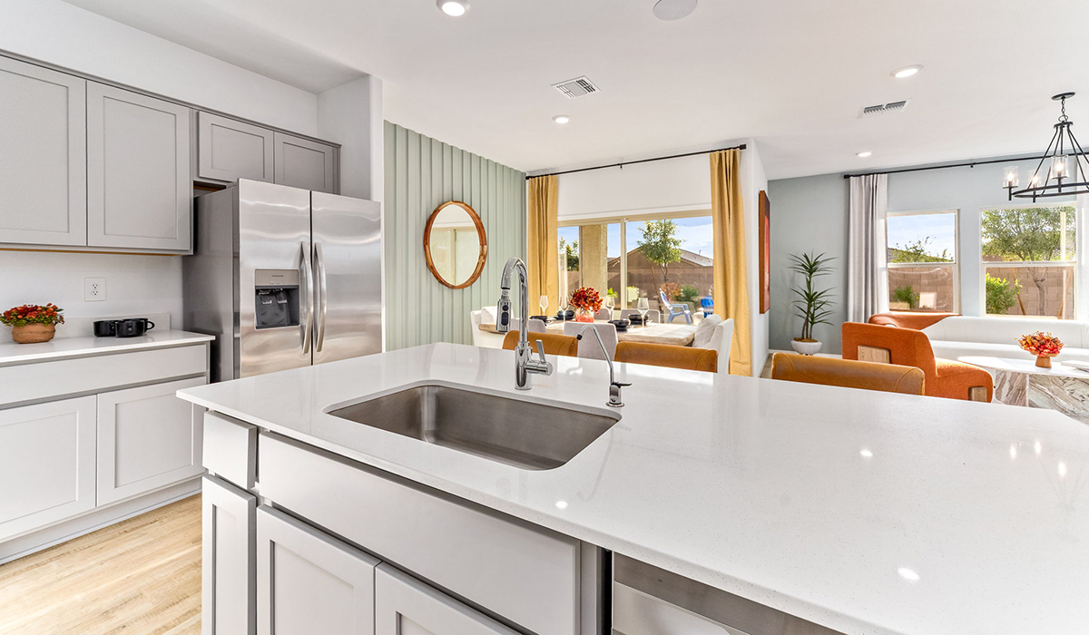 Step into The Cali at Hanson Ridge in Vail, Arizona - a thoughtfully crafted 1,823 sq. ft. single-story new home designed to offer a perfect harmony of comfort and desert elegance. As you enter through the inviting front porch, you're welcomed into a bright and airy living space that flows seamlessly into the great room, dining area, and kitchen. This open-concept design is perfect for both casual family living and entertaining. The kitchen, with its Quartz countertops, modern appliances, and a convenient pantry, is both stylish and functional, making meal preparation a breeze. The primary suite, located at the rear of the home, provides a private retreat with a spacious bedroom, a large walk-in closet, and an en-suite bathroom featuring dual vanities and a walk-in shower.  Whether you’re planning to create a dream outdoor oasis or simply enjoy the natural surroundings, this space offers endless possibilities. Built with modern living in mind, The Cali includes D.R. Horton’s Home is Connected® Smart Home package, featuring a smart thermostat, video doorbell, keyless entry, and a Wi-Fi enabled garage door opener. Energy efficiency is also a priority, with spray foam insulation and designs that meet the DOE Zero Energy Ready Home standards, ensuring long-term savings and environmental benefits.  Located within the serene Hanson Ridge community, residents of The Cali enjoy the luxury of space combined with easy access to urban amenities. Come home to The Cali, where comfort, style, and the beauty of Arizona living come together in perfect harmony.  *Images shown are for reference only. They depict the sales model home and may not represent the actual home.