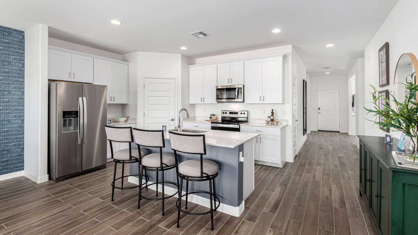 Step into The Cali at Hanson Ridge in Vail, Arizona - a thoughtfully crafted 1,823 sq. ft. single-story new home designed to offer a perfect harmony of comfort and desert elegance. As you enter through the inviting front porch, you're welcomed into a bright and airy living space that flows seamlessly into the great room, dining area, and kitchen. This open-concept design is perfect for both casual family living and entertaining. The kitchen, with its Quartz countertops, modern appliances, and a convenient pantry, is both stylish and functional, making meal preparation a breeze. The primary suite, located at the rear of the home, provides a private retreat with a spacious bedroom, a large walk-in closet, and an en-suite bathroom featuring dual vanities and a walk-in shower.  Whether you’re planning to create a dream outdoor oasis or simply enjoy the natural surroundings, this space offers endless possibilities. Built with modern living in mind, The Cali includes D.R. Horton’s Home is Connected® Smart Home package, featuring a smart thermostat, video doorbell, keyless entry, and a Wi-Fi enabled garage door opener. Energy efficiency is also a priority, with spray foam insulation and designs that meet the DOE Zero Energy Ready Home standards, ensuring long-term savings and environmental benefits.  Located within the serene Hanson Ridge community, residents of The Cali enjoy the luxury of space combined with easy access to urban amenities. Come home to The Cali, where comfort, style, and the beauty of Arizona living come together in perfect harmony.  *Images shown are for reference only. They depict the sales model home and may not represent the actual home.