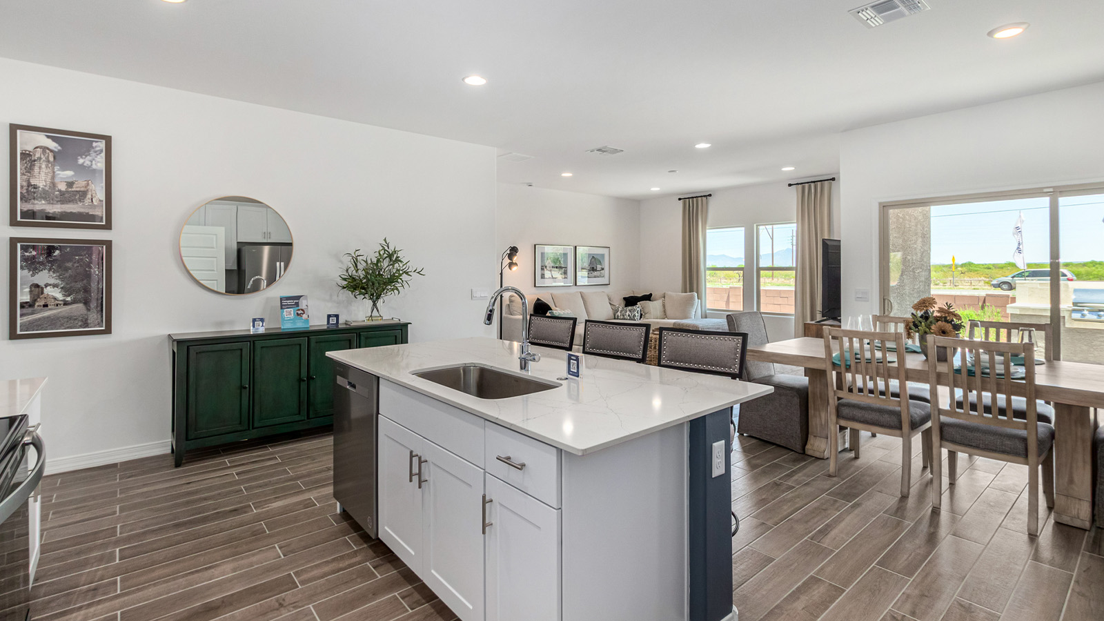 Step into The Cali at Hanson Ridge in Vail, Arizona - a thoughtfully crafted 1,823 sq. ft. single-story new home designed to offer a perfect harmony of comfort and desert elegance. As you enter through the inviting front porch, you're welcomed into a bright and airy living space that flows seamlessly into the great room, dining area, and kitchen. This open-concept design is perfect for both casual family living and entertaining. The kitchen, with its Quartz countertops, modern appliances, and a convenient pantry, is both stylish and functional, making meal preparation a breeze. The primary suite, located at the rear of the home, provides a private retreat with a spacious bedroom, a large walk-in closet, and an en-suite bathroom featuring dual vanities and a walk-in shower.  Whether you’re planning to create a dream outdoor oasis or simply enjoy the natural surroundings, this space offers endless possibilities. Built with modern living in mind, The Cali includes D.R. Horton’s Home is Connected® Smart Home package, featuring a smart thermostat, video doorbell, keyless entry, and a Wi-Fi enabled garage door opener. Energy efficiency is also a priority, with spray foam insulation and designs that meet the DOE Zero Energy Ready Home standards, ensuring long-term savings and environmental benefits.  Located within the serene Hanson Ridge community, residents of The Cali enjoy the luxury of space combined with easy access to urban amenities. Come home to The Cali, where comfort, style, and the beauty of Arizona living come together in perfect harmony.  *Images shown are for reference only. They depict the sales model home and may not represent the actual home.