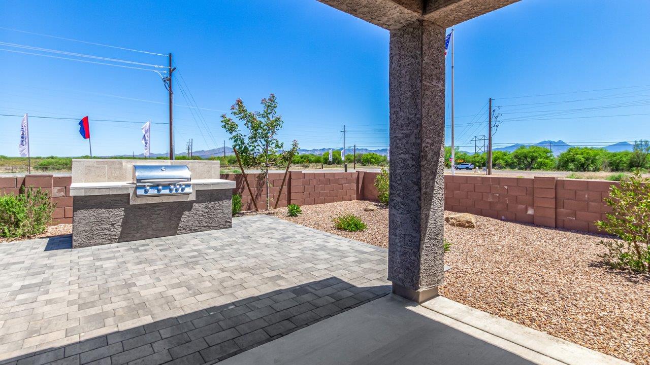 Step into The Cali at Hanson Ridge in Vail, Arizona - a thoughtfully crafted 1,823 sq. ft. single-story new home designed to offer a perfect harmony of comfort and desert elegance. As you enter through the inviting front porch, you're welcomed into a bright and airy living space that flows seamlessly into the great room, dining area, and kitchen. This open-concept design is perfect for both casual family living and entertaining. The kitchen, with its Quartz countertops, modern appliances, and a convenient pantry, is both stylish and functional, making meal preparation a breeze. The primary suite, located at the rear of the home, provides a private retreat with a spacious bedroom, a large walk-in closet, and an en-suite bathroom featuring dual vanities and a walk-in shower.  Whether you’re planning to create a dream outdoor oasis or simply enjoy the natural surroundings, this space offers endless possibilities. Built with modern living in mind, The Cali includes D.R. Horton’s Home is Connected® Smart Home package, featuring a smart thermostat, video doorbell, keyless entry, and a Wi-Fi enabled garage door opener. Energy efficiency is also a priority, with spray foam insulation and designs that meet the DOE Zero Energy Ready Home standards, ensuring long-term savings and environmental benefits.  Located within the serene Hanson Ridge community, residents of The Cali enjoy the luxury of space combined with easy access to urban amenities. Come home to The Cali, where comfort, style, and the beauty of Arizona living come together in perfect harmony.  *Images shown are for reference only. They depict the sales model home and may not represent the actual home.