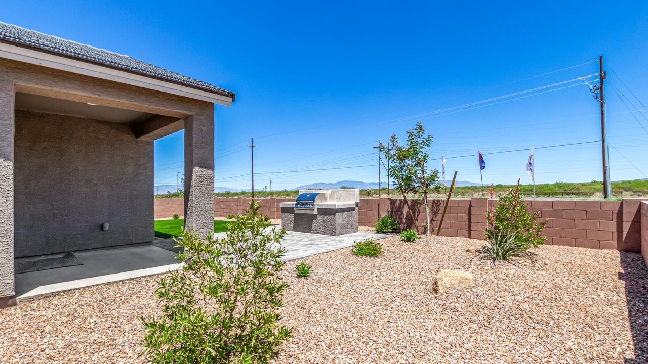 Step into The Cali at Hanson Ridge in Vail, Arizona - a thoughtfully crafted 1,823 sq. ft. single-story new home designed to offer a perfect harmony of comfort and desert elegance. As you enter through the inviting front porch, you're welcomed into a bright and airy living space that flows seamlessly into the great room, dining area, and kitchen. This open-concept design is perfect for both casual family living and entertaining. The kitchen, with its Quartz countertops, modern appliances, and a convenient pantry, is both stylish and functional, making meal preparation a breeze. The primary suite, located at the rear of the home, provides a private retreat with a spacious bedroom, a large walk-in closet, and an en-suite bathroom featuring dual vanities and a walk-in shower.  Whether you’re planning to create a dream outdoor oasis or simply enjoy the natural surroundings, this space offers endless possibilities. Built with modern living in mind, The Cali includes D.R. Horton’s Home is Connected® Smart Home package, featuring a smart thermostat, video doorbell, keyless entry, and a Wi-Fi enabled garage door opener. Energy efficiency is also a priority, with spray foam insulation and designs that meet the DOE Zero Energy Ready Home standards, ensuring long-term savings and environmental benefits.  Located within the serene Hanson Ridge community, residents of The Cali enjoy the luxury of space combined with easy access to urban amenities. Come home to The Cali, where comfort, style, and the beauty of Arizona living come together in perfect harmony.  *Images shown are for reference only. They depict the sales model home and may not represent the actual home.