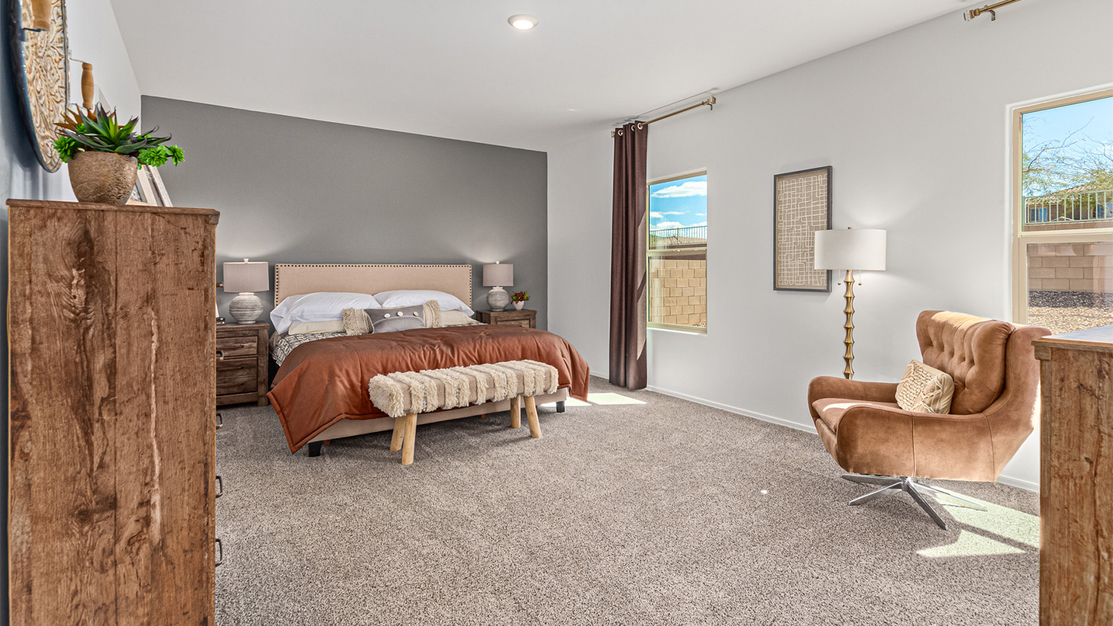 Step into The Kingston at Hanson Ridge in Vail Arizona – a perfect blend of comfort, modern living, and energy efficiency. This thoughtfully crafted single-story home spans 2,053 square feet and has four bedrooms and two bathrooms. This newly designed model offers harmony of comfort and desert elegance.  The open-concept design features a spacious great room that effortlessly connects with the kitchen and dining area, creating an inviting central hub for everyday living and entertaining. The kitchen is equipped with contemporary appliances and a pantry, offering ample storage and convenience for meal preparation and large center island. The primary bedroom, located at the rear of the home, provides a peaceful retreat with a private ensuite bathroom and a generous walk-in closet. The additional three bedrooms are positioned at the front of the house, offering versatility for use as guest rooms, a home office, or children’s bedrooms. Step outside to the covered patio, a perfect spot to enjoy the beautiful Arizona weather, whether for morning coffee or evening relaxation.  Built with energy efficiency as a priority, The Kingston includes smart home technology, which not only simplifies daily living but also helps reduce utility costs. A two-car garage provides ample parking and additional storage space, enhancing the home’s functionality. The Kingston at Hanson Ridge meets DOE Zero Energy Ready Home standards, ensuring sustainability and long-term savings.  Living at Hanson Ridge means more than just having a beautiful home. The community offers a peaceful lifestyle with incredible desert landscapes, mountain views, and easy access to I-10 for convenient commutes to Tucson and surrounding areas. Experience the charm and comfort of The Kingston at Hanson Ridge, where modern convenience meets the beauty of Arizona’s desert landscape.  *Images shown are for reference only. They depict The Kingston sales model home and may not represent the actual home.