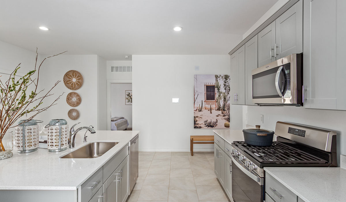 Step into The Kingston at Hanson Ridge in Vail Arizona – a perfect blend of comfort, modern living, and energy efficiency. This thoughtfully crafted single-story home spans 2,053 square feet and has four bedrooms and two bathrooms. This newly designed model offers harmony of comfort and desert elegance.  The open-concept design features a spacious great room that effortlessly connects with the kitchen and dining area, creating an inviting central hub for everyday living and entertaining. The kitchen is equipped with contemporary appliances and a pantry, offering ample storage and convenience for meal preparation and large center island. The primary bedroom, located at the rear of the home, provides a peaceful retreat with a private ensuite bathroom and a generous walk-in closet. The additional three bedrooms are positioned at the front of the house, offering versatility for use as guest rooms, a home office, or children’s bedrooms. Step outside to the covered patio, a perfect spot to enjoy the beautiful Arizona weather, whether for morning coffee or evening relaxation.  Built with energy efficiency as a priority, The Kingston includes smart home technology, which not only simplifies daily living but also helps reduce utility costs. A two-car garage provides ample parking and additional storage space, enhancing the home’s functionality. The Kingston at Hanson Ridge meets DOE Zero Energy Ready Home standards, ensuring sustainability and long-term savings.  Living at Hanson Ridge means more than just having a beautiful home. The community offers a peaceful lifestyle with incredible desert landscapes, mountain views, and easy access to I-10 for convenient commutes to Tucson and surrounding areas. Experience the charm and comfort of The Kingston at Hanson Ridge, where modern convenience meets the beauty of Arizona’s desert landscape.  *Images shown are for reference only. They depict the sales model home and may not represent the actual home.