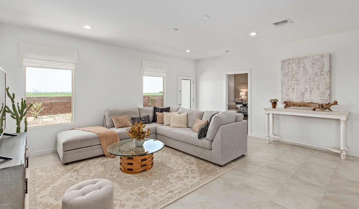 Step into The Kingston at Hanson Ridge in Vail Arizona – a perfect blend of comfort, modern living, and energy efficiency. This thoughtfully crafted single-story home spans 2,053 square feet and has four bedrooms and two bathrooms. This newly designed model offers harmony of comfort and desert elegance.  The open-concept design features a spacious great room that effortlessly connects with the kitchen and dining area, creating an inviting central hub for everyday living and entertaining. The kitchen is equipped with contemporary appliances and a pantry, offering ample storage and convenience for meal preparation and large center island. The primary bedroom, located at the rear of the home, provides a peaceful retreat with a private ensuite bathroom and a generous walk-in closet. The additional three bedrooms are positioned at the front of the house, offering versatility for use as guest rooms, a home office, or children’s bedrooms. Step outside to the covered patio, a perfect spot to enjoy the beautiful Arizona weather, whether for morning coffee or evening relaxation.  Built with energy efficiency as a priority, The Kingston includes smart home technology, which not only simplifies daily living but also helps reduce utility costs. A two-car garage provides ample parking and additional storage space, enhancing the home’s functionality. The Kingston at Hanson Ridge meets DOE Zero Energy Ready Home standards, ensuring sustainability and long-term savings.  Living at Hanson Ridge means more than just having a beautiful home. The community offers a peaceful lifestyle with incredible desert landscapes, mountain views, and easy access to I-10 for convenient commutes to Tucson and surrounding areas. Experience the charm and comfort of The Kingston at Hanson Ridge, where modern convenience meets the beauty of Arizona’s desert landscape.  *Images shown are for reference only. They depict the sales model home and may not represent the actual home.