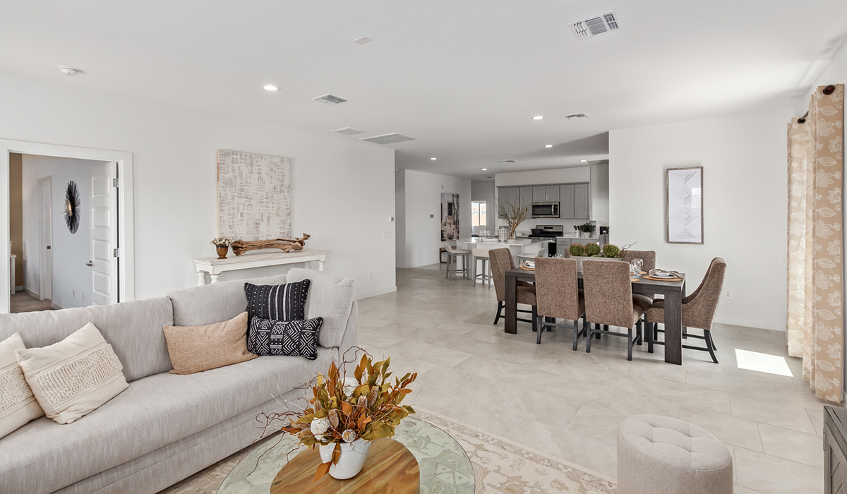 Step into The Kingston at Hanson Ridge in Vail Arizona – a perfect blend of comfort, modern living, and energy efficiency. This thoughtfully crafted single-story home spans 2,053 square feet and has four bedrooms and two bathrooms. This newly designed model offers harmony of comfort and desert elegance.  The open-concept design features a spacious great room that effortlessly connects with the kitchen and dining area, creating an inviting central hub for everyday living and entertaining. The kitchen is equipped with contemporary appliances and a pantry, offering ample storage and convenience for meal preparation and large center island. The primary bedroom, located at the rear of the home, provides a peaceful retreat with a private ensuite bathroom and a generous walk-in closet. The additional three bedrooms are positioned at the front of the house, offering versatility for use as guest rooms, a home office, or children’s bedrooms. Step outside to the covered patio, a perfect spot to enjoy the beautiful Arizona weather, whether for morning coffee or evening relaxation.  Built with energy efficiency as a priority, The Kingston includes smart home technology, which not only simplifies daily living but also helps reduce utility costs. A two-car garage provides ample parking and additional storage space, enhancing the home’s functionality. The Kingston at Hanson Ridge meets DOE Zero Energy Ready Home standards, ensuring sustainability and long-term savings.  Living at Hanson Ridge means more than just having a beautiful home. The community offers a peaceful lifestyle with incredible desert landscapes, mountain views, and easy access to I-10 for convenient commutes to Tucson and surrounding areas. Experience the charm and comfort of The Kingston at Hanson Ridge, where modern convenience meets the beauty of Arizona’s desert landscape.  *Images shown are for reference only. They depict the sales model home and may not represent the actual home.