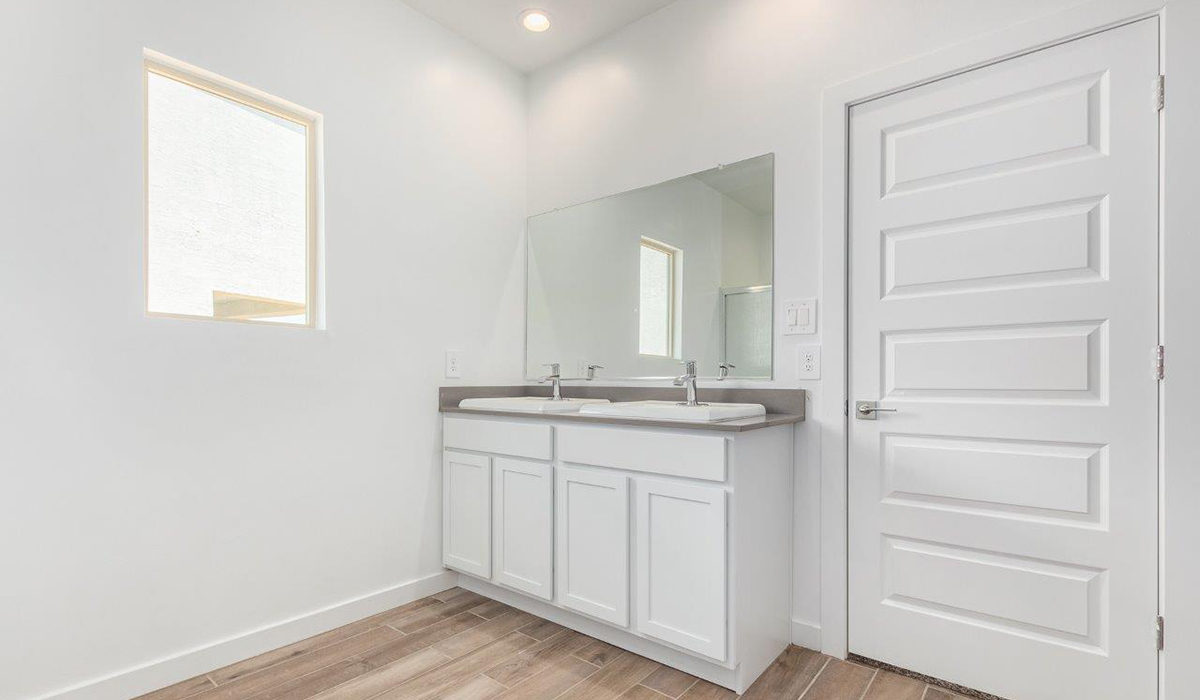 Step into The Kingston at Hanson Ridge in Vail Arizona – a perfect blend of comfort, modern living, and energy efficiency. This thoughtfully crafted single-story home spans 2,053 square feet and has four bedrooms and two bathrooms. This newly designed model offers harmony of comfort and desert elegance.  The open-concept design features a spacious great room that effortlessly connects with the kitchen and dining area, creating an inviting central hub for everyday living and entertaining. The kitchen is equipped with contemporary appliances and a pantry, offering ample storage and convenience for meal preparation and large center island. The primary bedroom, located at the rear of the home, provides a peaceful retreat with a private ensuite bathroom and a generous walk-in closet. The additional three bedrooms are positioned at the front of the house, offering versatility for use as guest rooms, a home office, or children’s bedrooms. Step outside to the covered patio, a perfect spot to enjoy the beautiful Arizona weather, whether for morning coffee or evening relaxation.  Built with energy efficiency as a priority, The Kingston includes smart home technology, which not only simplifies daily living but also helps reduce utility costs. A two-car garage provides ample parking and additional storage space, enhancing the home’s functionality. The Kingston at Hanson Ridge meets DOE Zero Energy Ready Home standards, ensuring sustainability and long-term savings.  Living at Hanson Ridge means more than just having a beautiful home. The community offers a peaceful lifestyle with incredible desert landscapes, mountain views, and easy access to I-10 for convenient commutes to Tucson and surrounding areas. Experience the charm and comfort of The Kingston at Hanson Ridge, where modern convenience meets the beauty of Arizona’s desert landscape.